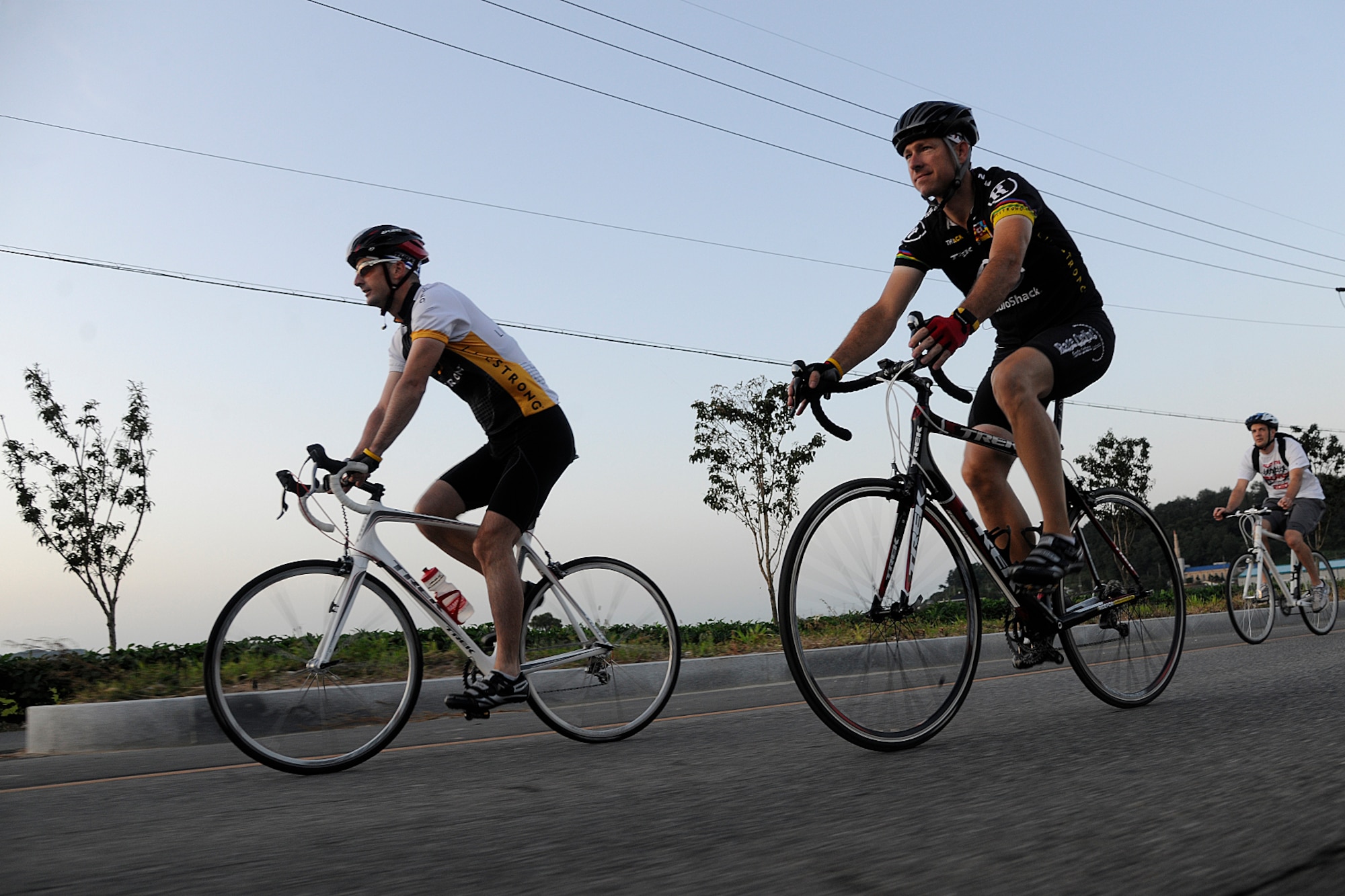 KUNSAN AIR BASE, Republic of Korea -- Three 8th Maintenance Squadron Airmen begin their more than 105 mile trek from Kunsan AB to Osan AB here Sept. 3 in support of The Lance Armstrong Foundation and to increase cancer awareness. The cycling trio raised more than $1,300 for the Combined Federal Campaign charity. (U.S. Air Force photo/Staff Sgt. Rasheen Douglas)