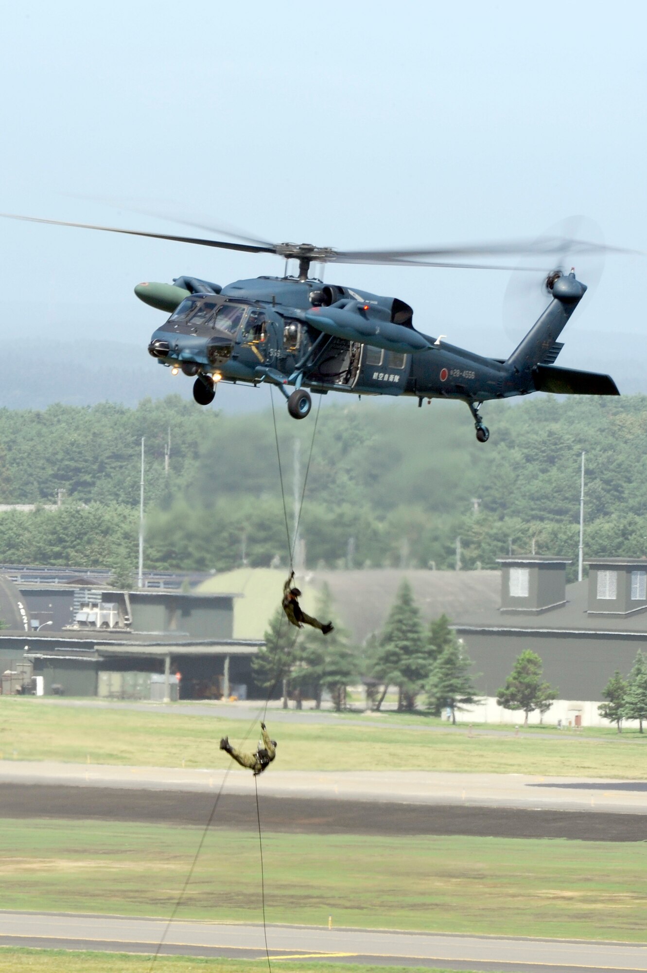 MISAWA AIR BASE, Japan - A Japan Air Self-Defense Force UH-60J search and rescue helicopter performs an aerial demonstration during Misawa's 32nd-annual air fest Sept. 4. Air Fest 2011 was an opportunity for approximately 100,000 attendees to see eight aerial demonstrations with 19 static displays of JASDF, U.S. Air Force, U.S. Navy aircraft and private aircraft operators. Air Fest 2011 also marked the last flight of Miss Veedol, a single-engine aircraft that, in 1931, flew non-stop across the Pacific Ocean from Sabishiro Beach, Misawa, Japan to Wenatchee, Washington, U.S. (U.S. Air Force photo/Tech. Sgt. Marie Brown)