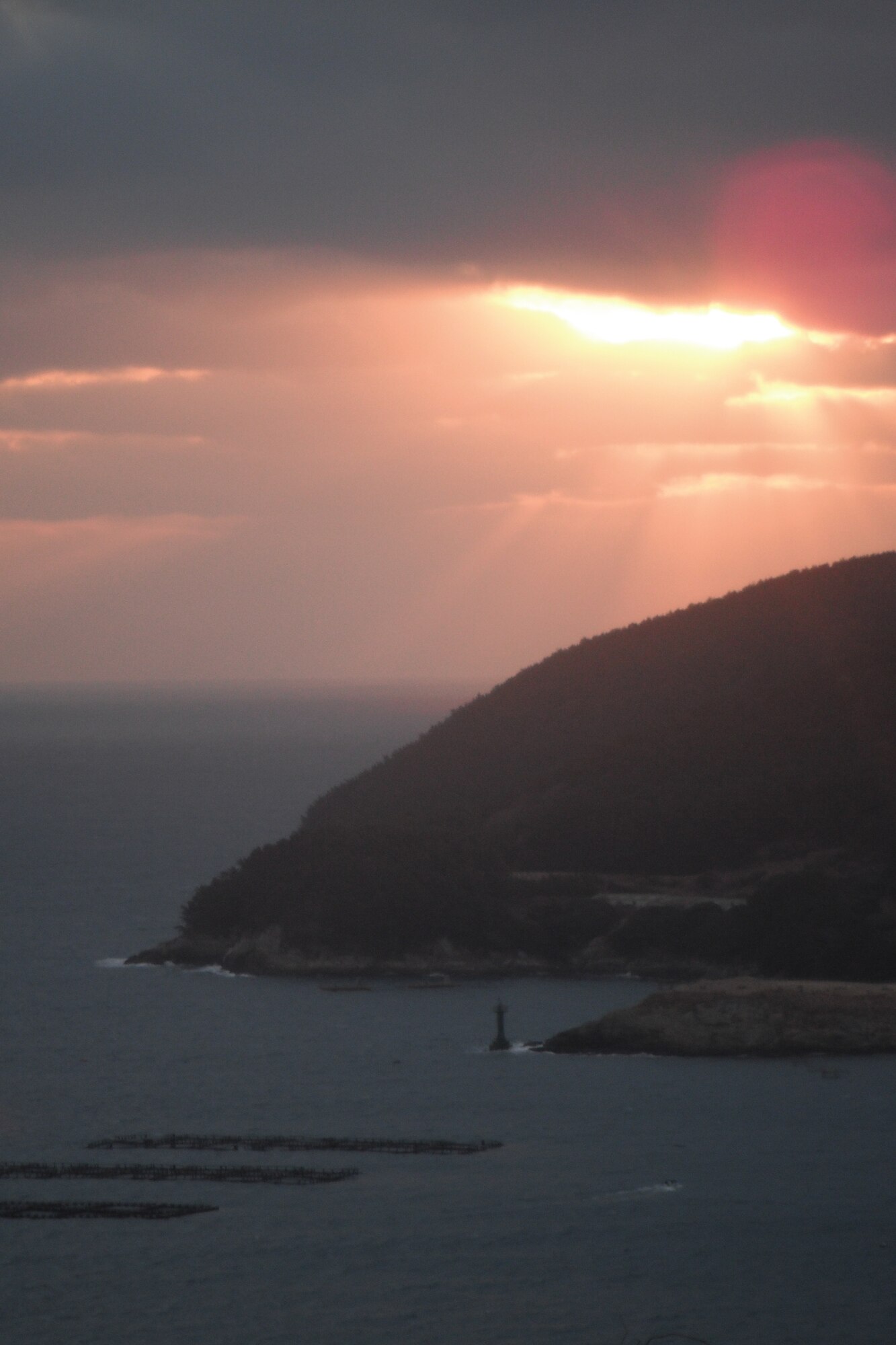 Rays of morning sunlight emerge through clouds over the Geoje district of Hallyeohaesang National Park, Republic of Korea. (U.S. Air Force photo/Staff Sgt. Eric Burks)