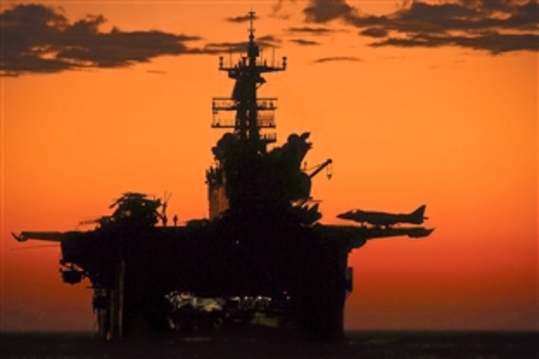 The sun sets in the Pacific Ocean as the amphibious assault ship USS Makin Island and the embarked 11th Marine Expeditionary Unit conduct operations off the coast of southern California, Sept. 5, 2011.