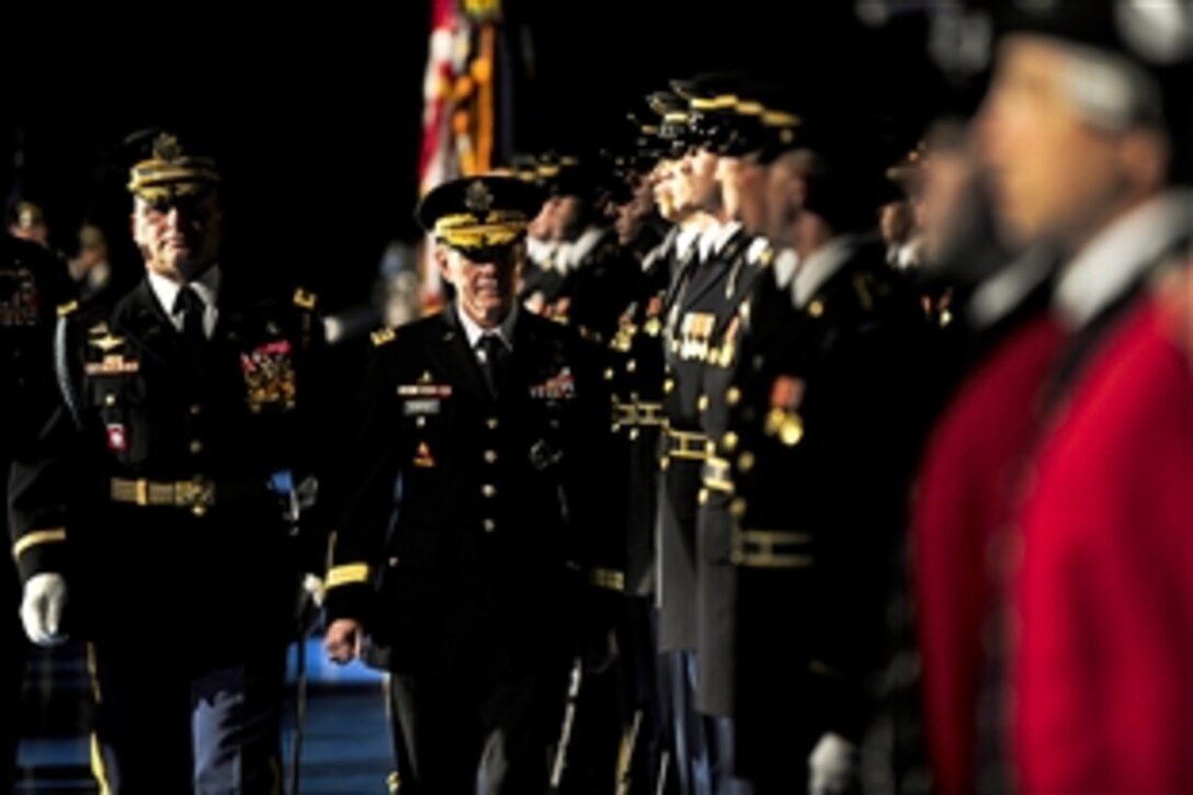 Army Gen. Martin E. Dempsey, center, conducts a final troop inspection as the outgoing chief of staff during a change-of-responsibility ceremony in Conmy Hall on Joint Base Myer-Henderson Hall, Va., Sept. 7, 2011. Army Gen. Raymond T. Odierno assumed responsibility from Dempsey as the 38th Army chief of staff.