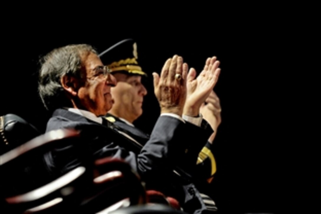 Defense Secretary Leon E. Panetta and Army Gen. Raymond T. Odierno applaud outgoing Army Chief Gen. Martin E. Dempsey after he was awarded the Army Distinguished Service Medal during a ceremony in Conmy Hall on Joint Base Myer-Henderson Hall, Va., Sept. 7, 2011.