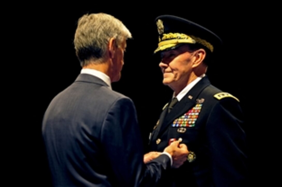 Army Secretary John McHugh awards outgoing Army Chief of Staff Gen. Martin E. Dempsey the Army Distinguished Service Medal during a ceremony in Conmy Hall on Joint Base Myer-Henderson Hall, Va., Sept. 7, 2011. Dempsey relinquished his post to Army Gen. Raymond T. Odierno, the new chief of staff.