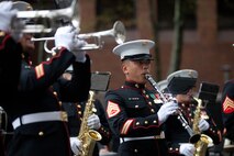 Staff Sergeant Rico Selbo plays along with the 2nd Marine Air Wing Band in the rain next to New York Vietnam Veterans Memorial here, Sept. 7. Selbo reenlisted in the Marine Corps earlier in the day overlooking the World Trade Center site. On Sept. 11, 2001 the San Antonio-native was 17 years old and reciting his oath of enlistment at a Military Entrance Processing Station in Texas when the twin towers were attacked. Ten years later, the Iraq War veteran Marine clarinetist asked to extend his service in the Marine Corps near Ground Zero. Selbo is a member of the 2nd Marine Air Wing Band stationed at Marine Corps Air Station Cherry Point, N.C. The band is in New York to commemorate the 10th anniversary of the Sept. 11th terrorist attacks.
