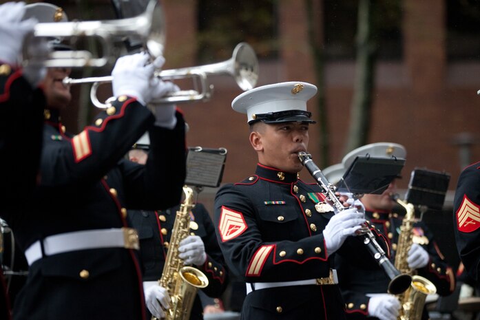 Staff Sergeant Rico Selbo plays along with the 2nd Marine Air Wing Band in the rain next to New York Vietnam Veterans Memorial here, Sept. 7. Selbo reenlisted in the Marine Corps earlier in the day overlooking the World Trade Center site. On Sept. 11, 2001 the San Antonio-native was 17 years old and reciting his oath of enlistment at a Military Entrance Processing Station in Texas when the twin towers were attacked. Ten years later, the Iraq War veteran Marine clarinetist asked to extend his service in the Marine Corps near Ground Zero. Selbo is a member of the 2nd Marine Air Wing Band stationed at Marine Corps Air Station Cherry Point, N.C. The band is in New York to commemorate the 10th anniversary of the Sept. 11th terrorist attacks.
