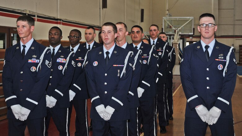 Andersen Air Force Base Honor Guard trainers (left) stand by their graduates during the first Base Honor Guard graduation here Aug. 29. Volunteers from different squadrons on Andersen attended a two-week training course leading up to the graduation. Base Honor Guard training was developed to standardize how ceremonies are performed geared to the specific base’s preference for military ceremonial support.  (U.S. Air Force photo by Staff Sgt. Alexandre Montes)