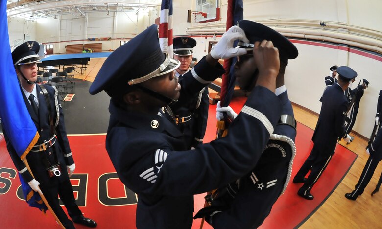 Base Honor Guard members check each other prior to a funeral demonstration for Airmen here Aug. 29. The Base Honor Guard performed a mock funeral form Airman on Andersen. Following the demonstration, the first Andersen AFB Honor Guard graduation was held after two-weeks training. Base Honor Guard training was developed to standardize how ceremonies are performed geared to the specific base’s preference for military ceremonial support. (U.S. Air Force photo by Staff Sgt. Alexandre Montes)