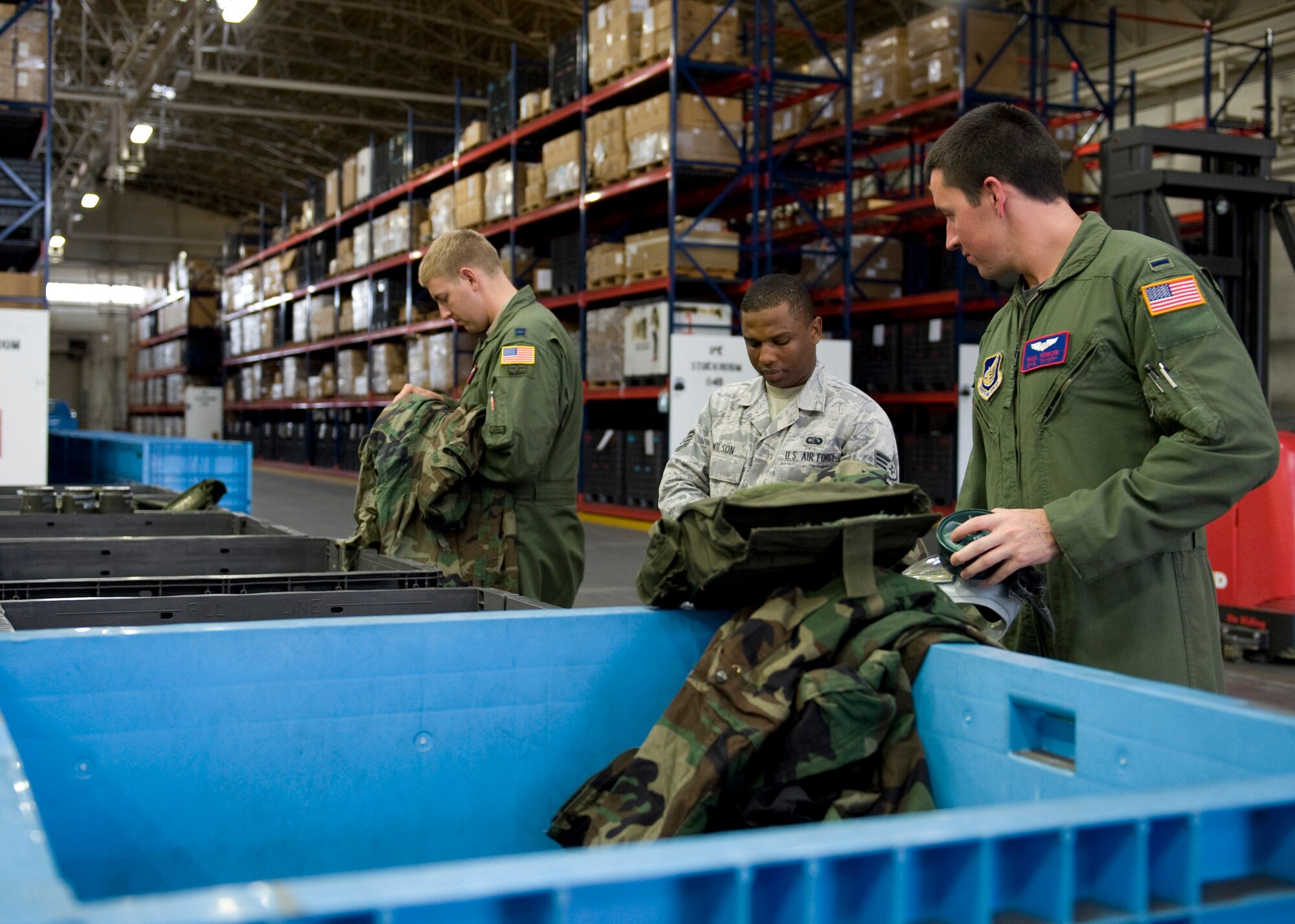 YOKOTA AIR BASE, Japan -- Yokota members exchange old individual protective equipment for new gear in preparation for a phase II operational readiness exercise at Yokota Air Base, Japan, Sept. 6, 2011. (U.S Air Force photo/Senior Airman Andrea Salazar)