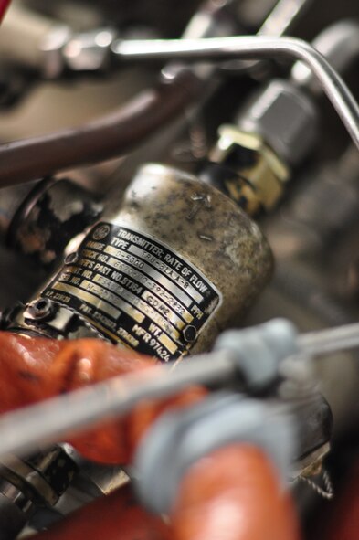 The fuel-flow transmitter regulates the fuel that goes to the engine and sends a signal back to the pilot that tells how much fuel is being sent to the engines. “It’s a critical system component that gets the engines going and keeps the aircraft in the air,” Tech. Sgt. Tremaine Smith said. “Without it the pilots would never get off the ground.” Hundreds of feet of wire connect the fuel-flow gauge in the cockpit to the fuel-flow transmitter in the engine. Smith found two wires that were swapped in this harness that was causing a problem in an A-10 Thunderbolt II when he was stationed at Davis Monthan Air Force Base, Ariz. (U.S. Air Force photo/Tech. Sgt. Chad Thompson)