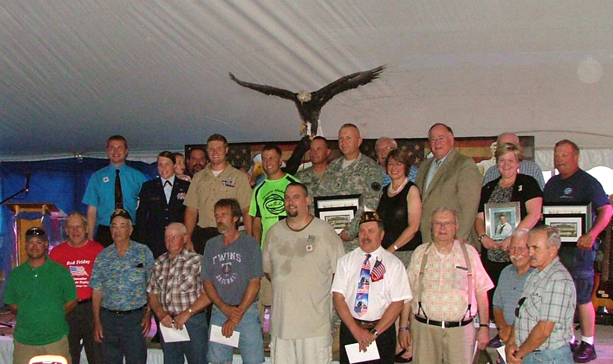 (Top row, second from left) Master Sgt. Rebecca Smith, 22nd Force Support Squadron Military Personnel Section superintendent, stands with honorees at the “Tribute to the Troops” ceremony July 22, 2011, West Concord, Minn.  Smith and her husband were among those honored with a “Key to the City” in recognition of their military service. Courtesy photo.

