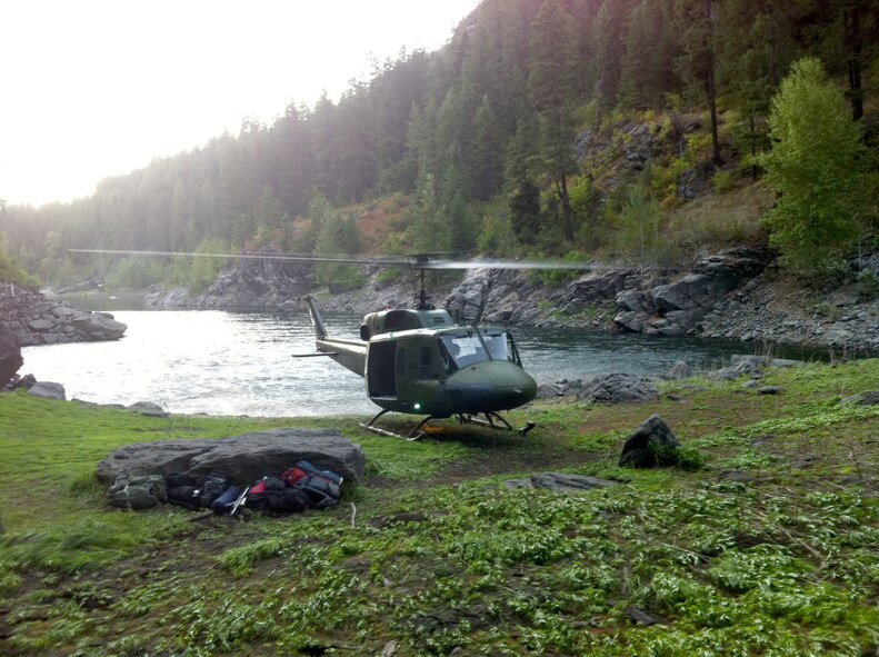 A UH-1N Iriquois helicopter sits in a clear area before the last pick up of medical personnel following the medical evacuation of Anthony Beam, an injured hiker in the Colville National Forest, Wash.  (U.S. Air FOrce photo/Tech Sgt. Steven Perez)