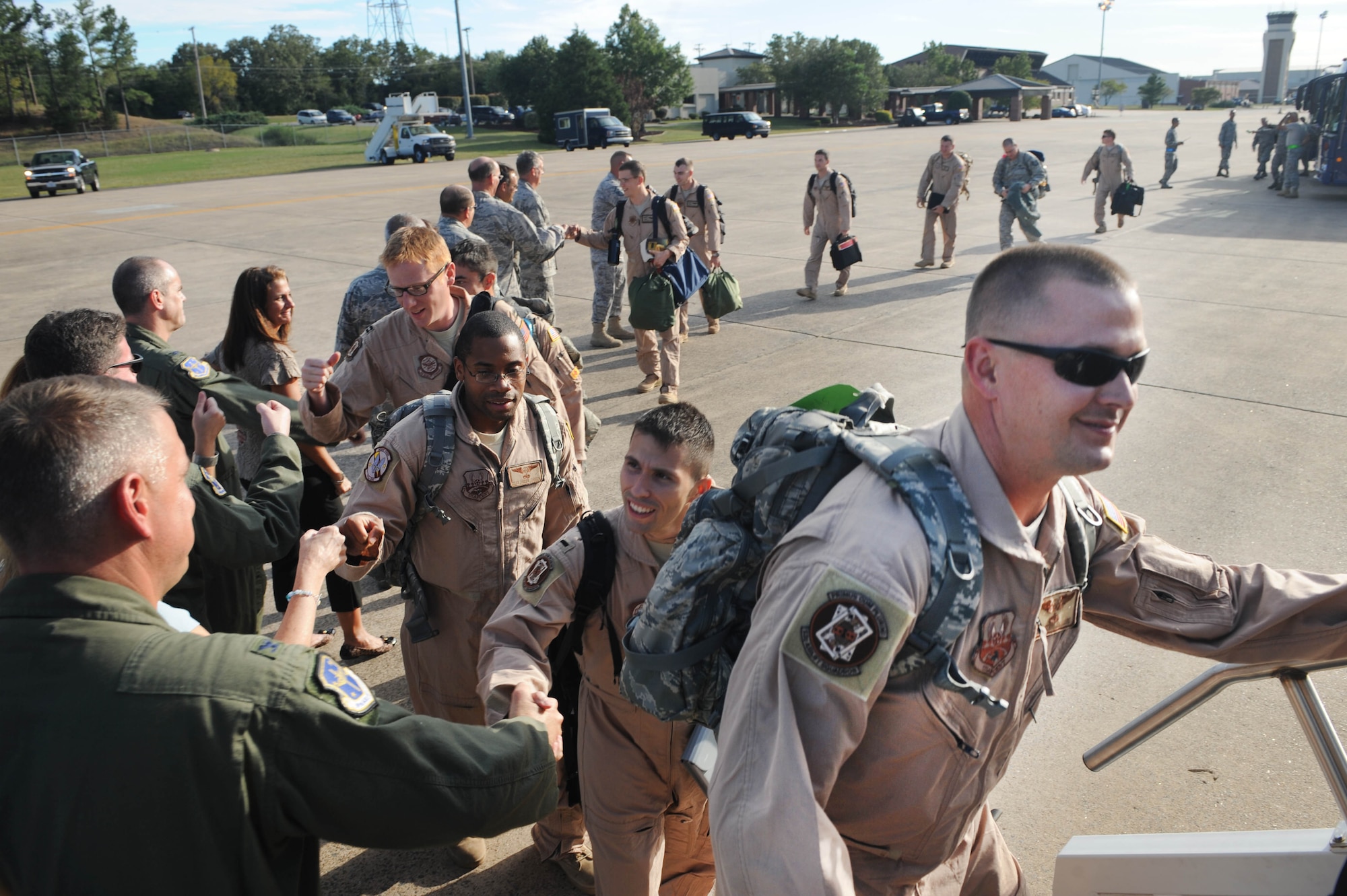 More than 100 Team Little Rock and Total Force Airmen boarded an aircraft an aircraft yesterday evening for deployments to Southwest Asia. Some Airmen from other active-duty, Guard and Reserve units came here to catch the flight overseas. The base averages about 800 Airmen deployed at any given time. (U.S. Air Force photo by Staff Sgt. Jim Araos)