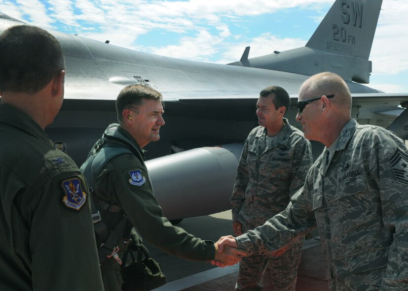 U.S. Air Force Maj. Gen. Stephen Hoog, 9th Air Force commander, shakes hands with Chief Master Sgt. Frank Batten, 23rd Wing command chief, after arriving to Moody Air Force Base, Ga., Sept. 7, 2011. Hoog was also welcomed by Col. Billy Thompson, 23rd Wing commander, Col. Scott Kindsvater, 93d Air Ground Operations Wing (AGOW) commander, and Chief Master Sgt. Atticus Smith, 93d AGOW command chief.  (U.S. Air Force photo by Airman 1st Class Douglas Ellis/Released)
