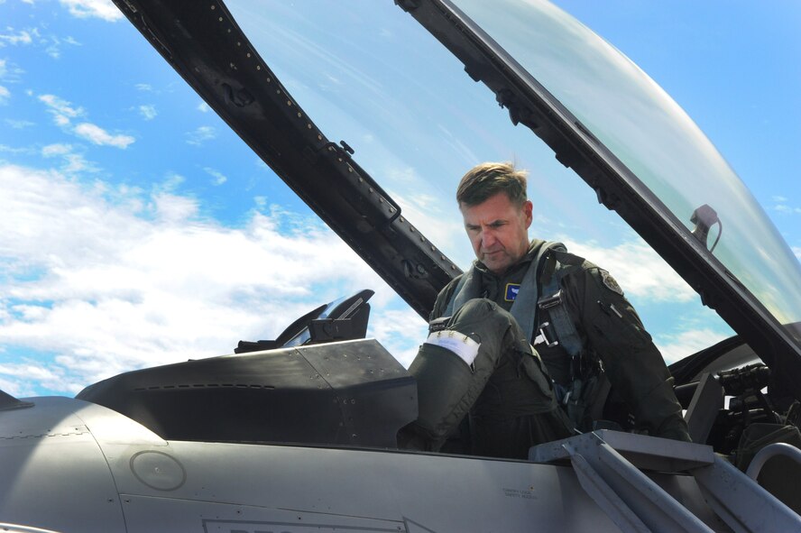 U.S. Air Force Maj. Gen. Stephen Hoog, 9th Air Force commander, prepares to exit an F-16 Fighting Falcon at Moody Air Force Base, Ga., Sept. 7, 2011. Hoog visited to present a Distinguished Flying Cross Medal to a Moody Airman, meet with leadership and view Moody’s mission capabilities. (U.S. Air Force photo by Airman 1st Class Douglas Ellis/Released)
