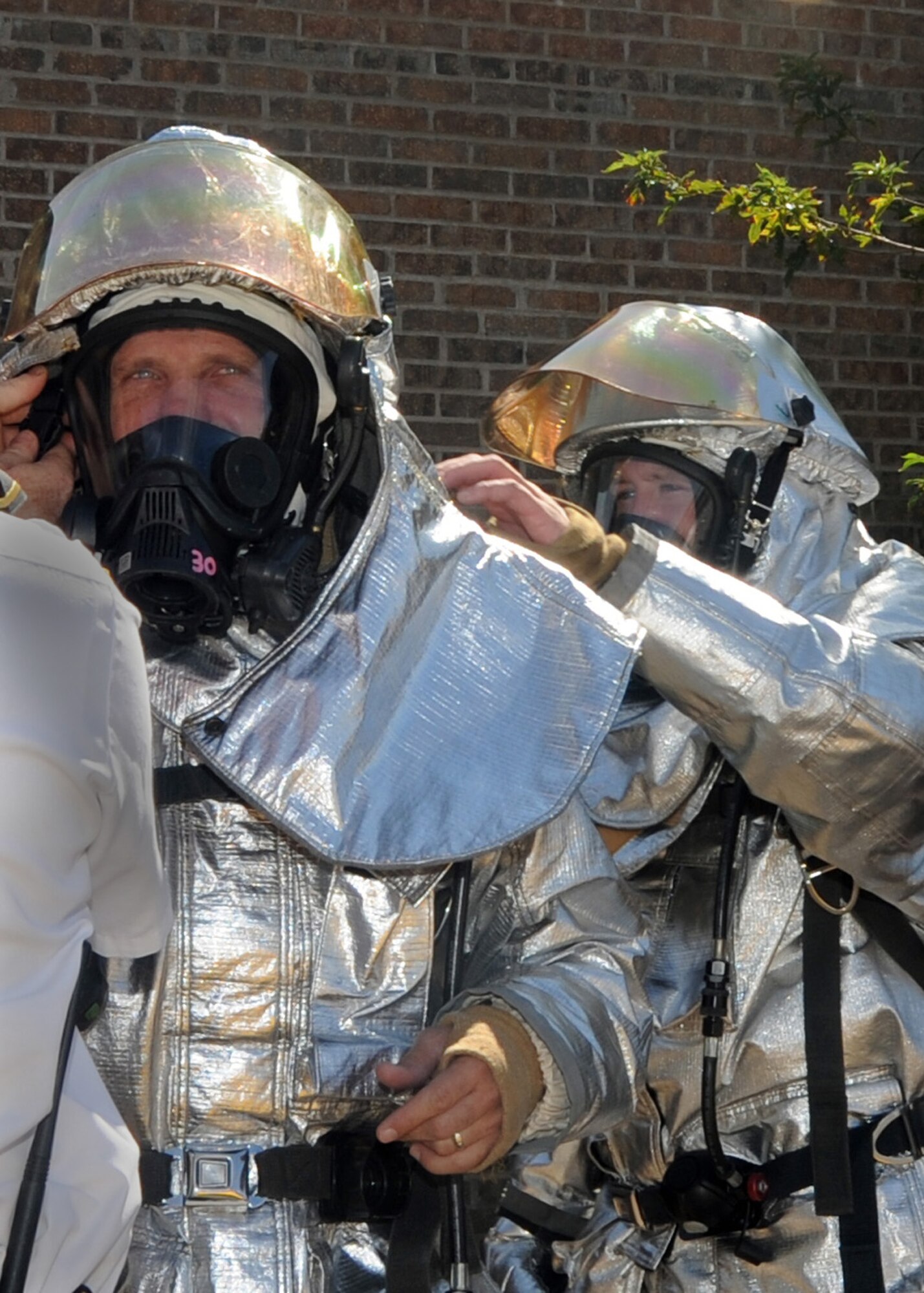 ALTUS AIR FORCE BASE, Okla. – Col. Anthony B. Krawietz, 97th Air Mobility Wing commander, is suited up in preparation for a demonstration performed by 97th Civil Engineer Squadron firefighters at building 333 Sept. 8, 2011. During the demonstration Col. Krawietz donned a firefighter suit to learn firsthand what it is like to rescue a person from a smoky room. (U.S. Air Force photo by Airman 1st Class Kenneth W. Norman / Released / 97th Air Mobility Wing Public Affairs)
