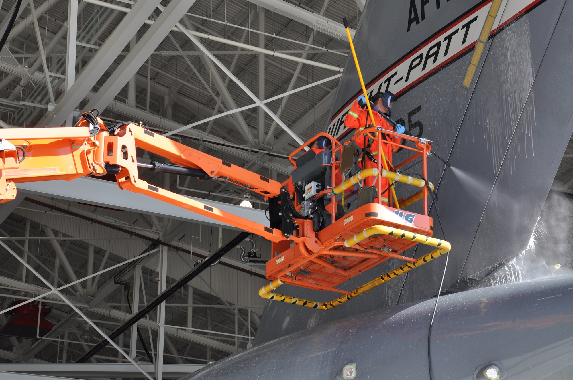 WRIGHT-PATTERSON AIR FORCE BASE, Ohio - Senior Airman Steven Klepeisz, 445th Aircraft Maintenance Squadron, washes the tail section of the wing's C-17 Globemaster III Aug. 12. (U.S. Air Force photo/Staff Sgt. Amanda Duncan)