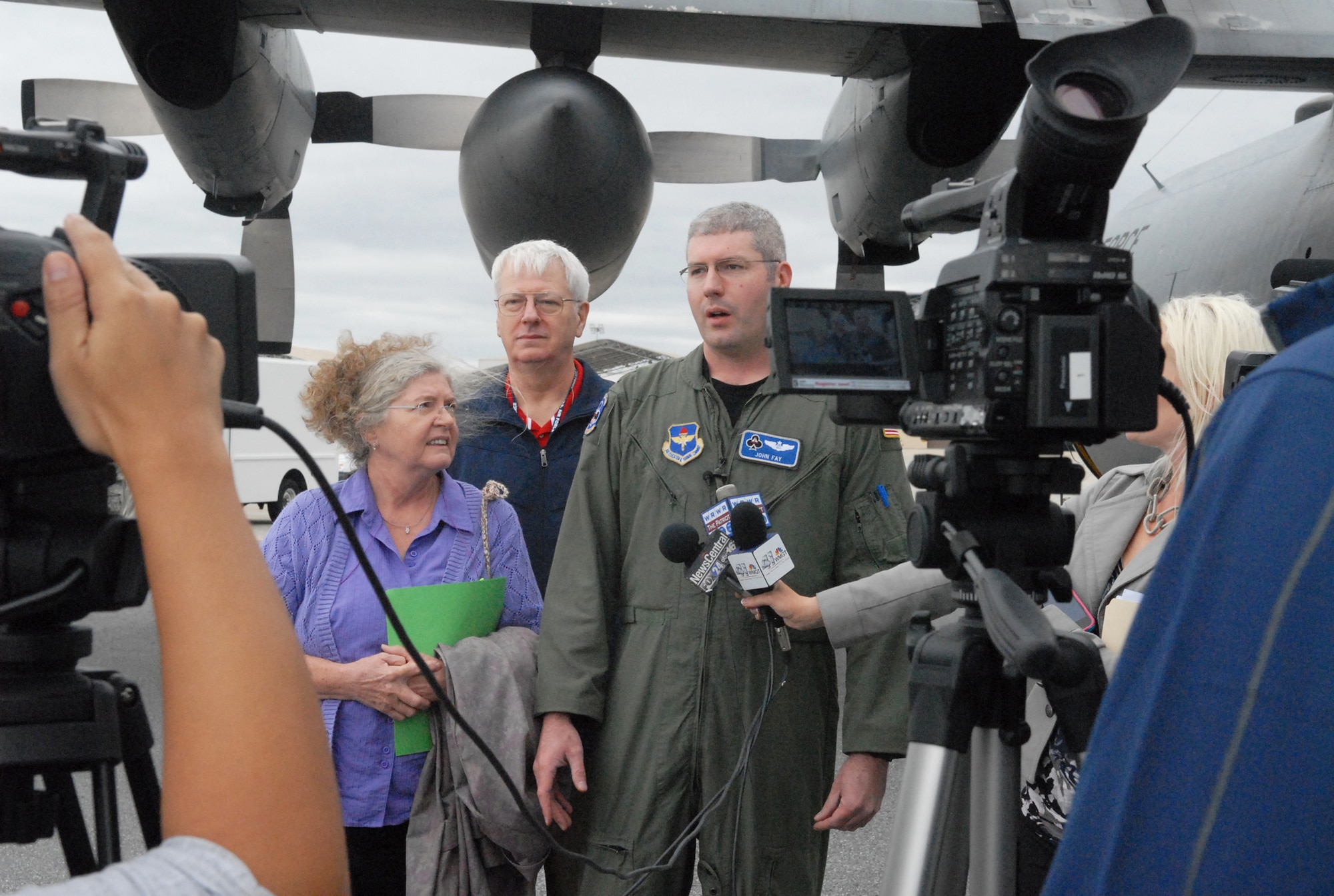 Maj. John Fay, a C-130 training instructor at Little Rock Air Force Base and 1997 Houston County High School graduate, was the navigator of the crew who brought the C-130E to Robins. Here he talks to media with his parents John and Cathy, a retired Air Force KC-135 pilot and nurse respectively. U. S. Air Force photo by Sue Sapp