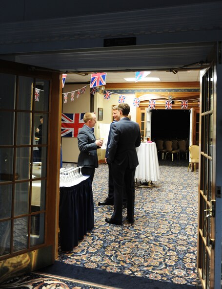 Colonel Patrick Doherty speaks with Royal Air Force exchange officers during the social hour preceding the Battle of Britain celebration at Heritage Hall on Seymour Johnson Air Force Base, N.C., Sept. 1.  The celebration is held yearly to commemorate the decisive World War II battle which lasted from July 10 to Oct. 31, 1940.  Doherty is the commander of the 4th Fighter Wing and hails from Lincoln, Neb.  (U.S. Air Force photo by 2nd Lt. Keavy Rake/Released)