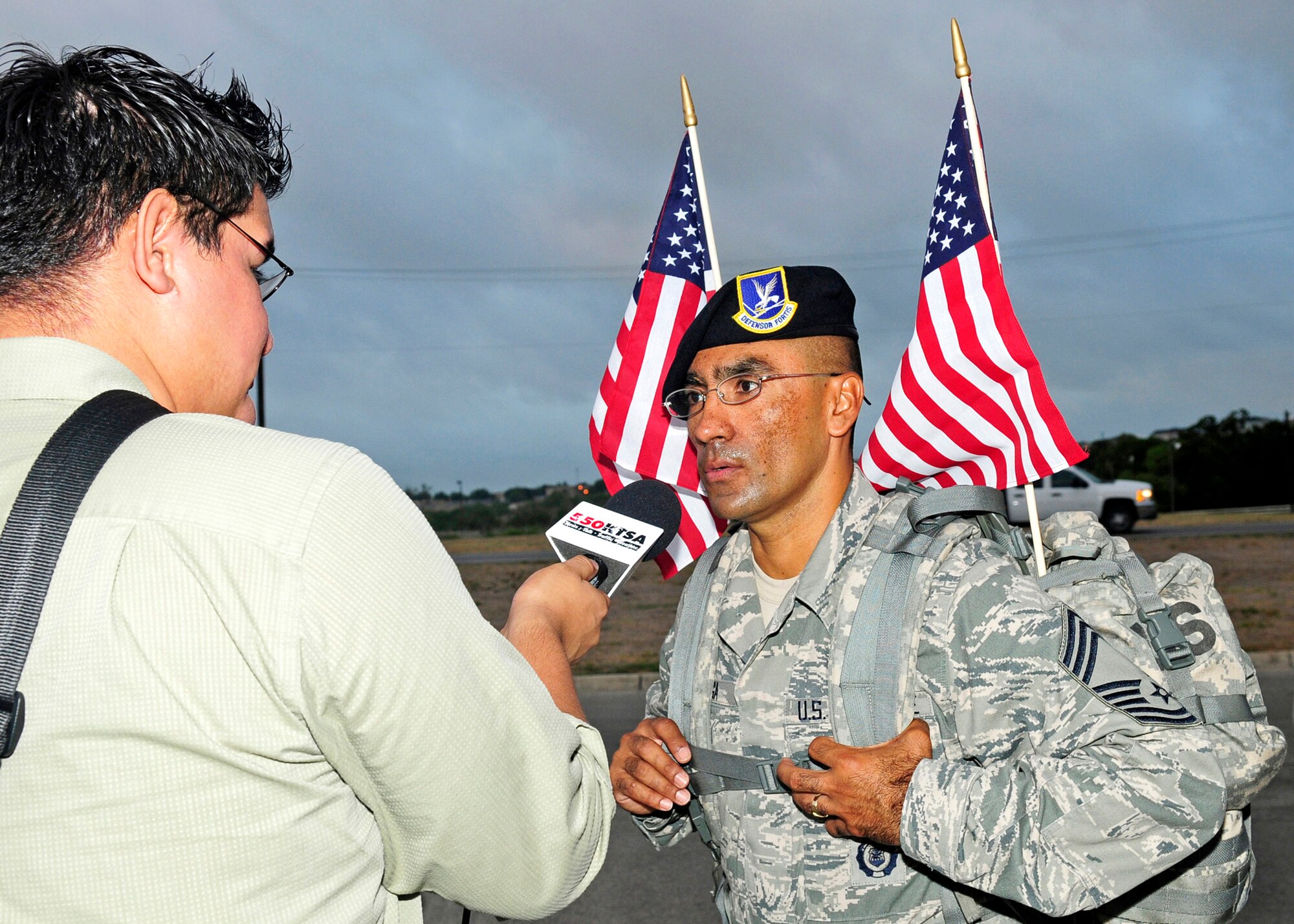 Chief Master Sgt. Domingo Ortega, the top-ranked senior noncommissioned officer assigned to the Texas Air National Guard's 149th Fighter Wing, discusses "The Ruck March to Remember 9/11" with a reporter from San Antonio, Texas, at Lackland Air Force Base, July 12, 2011.
(Air National Guard photo by Senior Master Sgt. Miguel D. Arellano/Released)