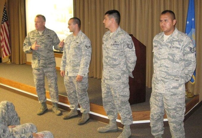 Colonel Erik Hansen recognizes several Airmen at one of his recent Commander's Calls last week at Joint Base Charleston. Hansen conducted 12 Commander's Calls in four days, speaking to 437th Airlift Wing personnel about issues that directly affect them. 
