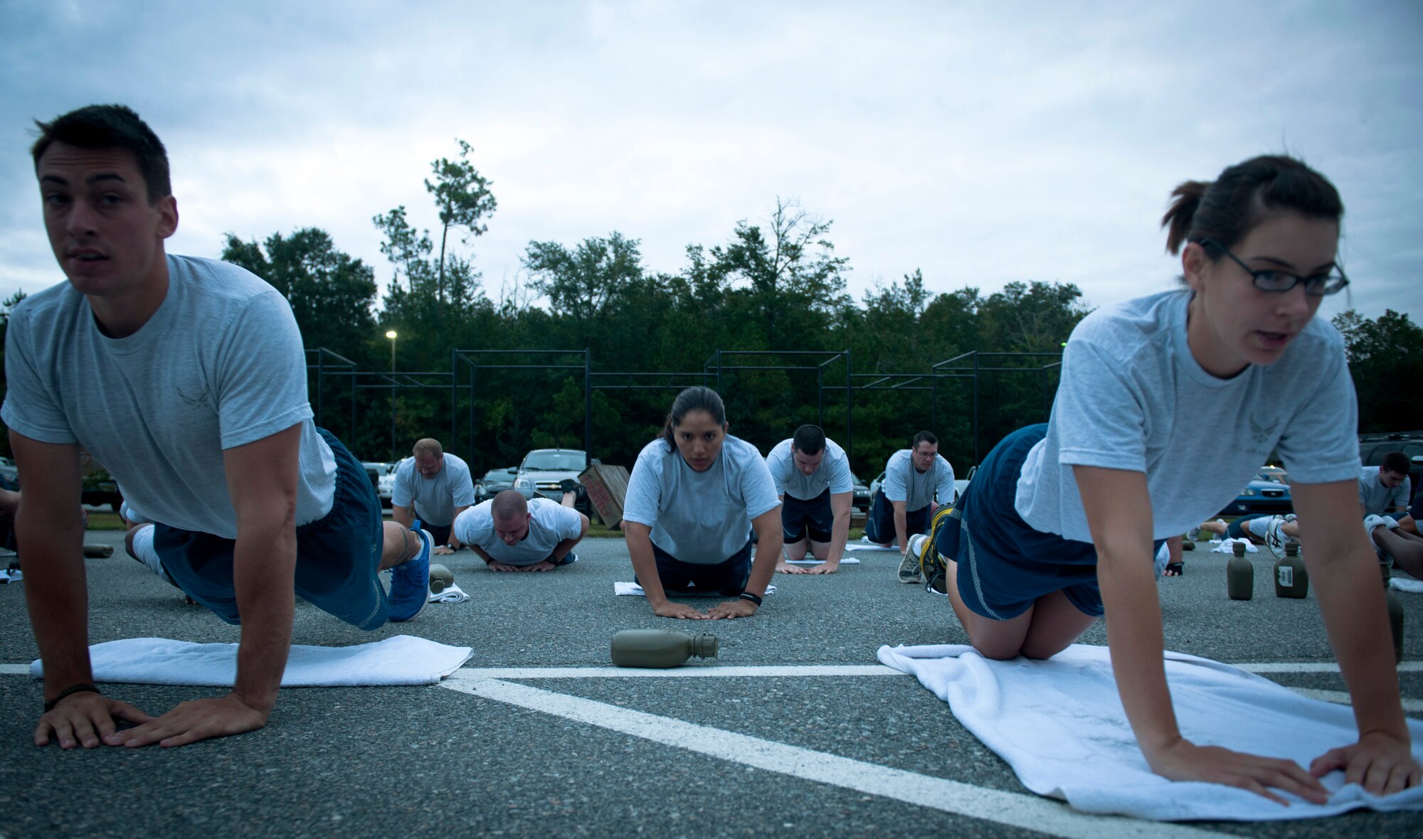 U.S. Air Force Staff Sgt. Camille Espinoza 823rd Base Defense Squadron fireteam leader, performs diamond pushups during Sergeant Rock physical training (PT) at Moody Air Force Base Ga., Sept. 6, 2011. Sergeant Rock PT was put in place to help individuals improve their physical strength and mental toughness. (U.S. Air Force photo by Airman 1st Class Joshua Green/Released)              
