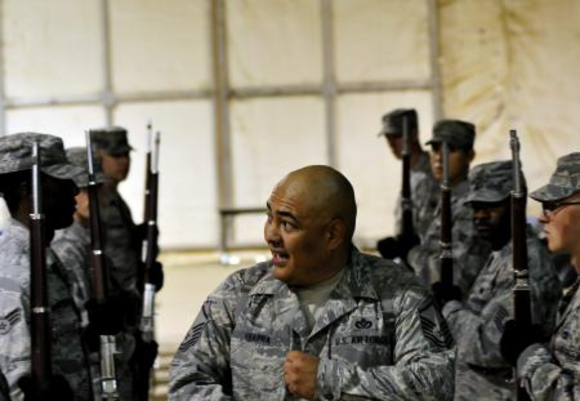 ALI BASE, Iraq - Master Sgt. Herman Ybarra demonstrates drill team techniques Aug. 28, 2011, to his 407th Air Expeditionary Group Honor Guard in preparation for their 9/11 ceremony at Ali Base, Iraq. Ybarra is deployed from Vandenberg Air Force Base, Calif., and is a native of Corpus Christi, Texas. (U.S. Air Force photo/Master Sgt. Cecilio Ricardo)


