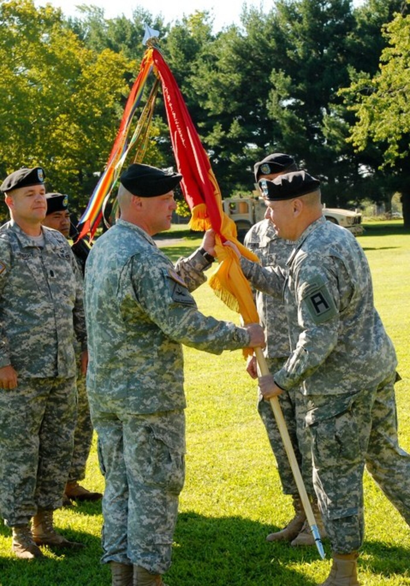 Army Col. Michael S. Shrout, 72nd Field Artillery Brigade commander, accepts the unit colors from Maj. Gen. Kevin R. Wendel, First Army Division East commander, during an assumption of command ceremony Sept. 1 at Joint Base McGuire-Dix-Lakehurst. The 72nd Field Artillery Brigade is responsible for planning mobilization training operations for all servicemembers preparing for deployment at enduring Mobilization Training Center Dix. (U.S. Army photo by Sgt. 1st Class Alyn McLeod/Released) 