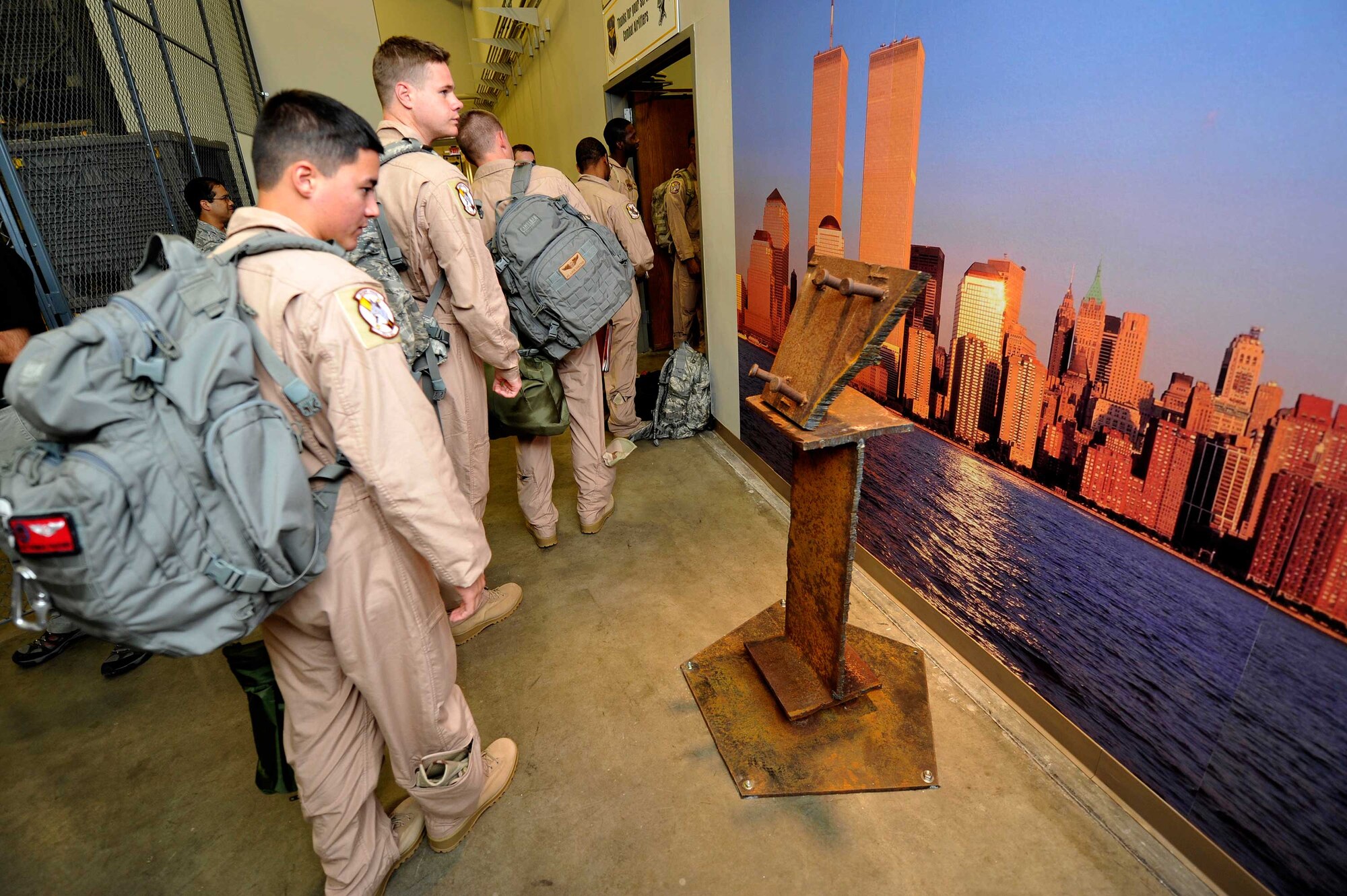 More than 100 Airmen deployed Sept. 7, 2011 to support combat operations in Southwest Asia.  As they transition through the base’s Mobility Processing Center, they took time to view the dedicated memorial steel from the World Trade Center, displayed on Little Rock Air Force Base, Ark.  The monument is made from two pieces of World Trade Center steel, one from the New York Fire Department Academy (the one shaped like the state of Arkansas) and the other from the Port Authority of New York/New Jersey (an I-Beam).  (U.S. Air Force photo by Staff Sgt. Chris Willis)
