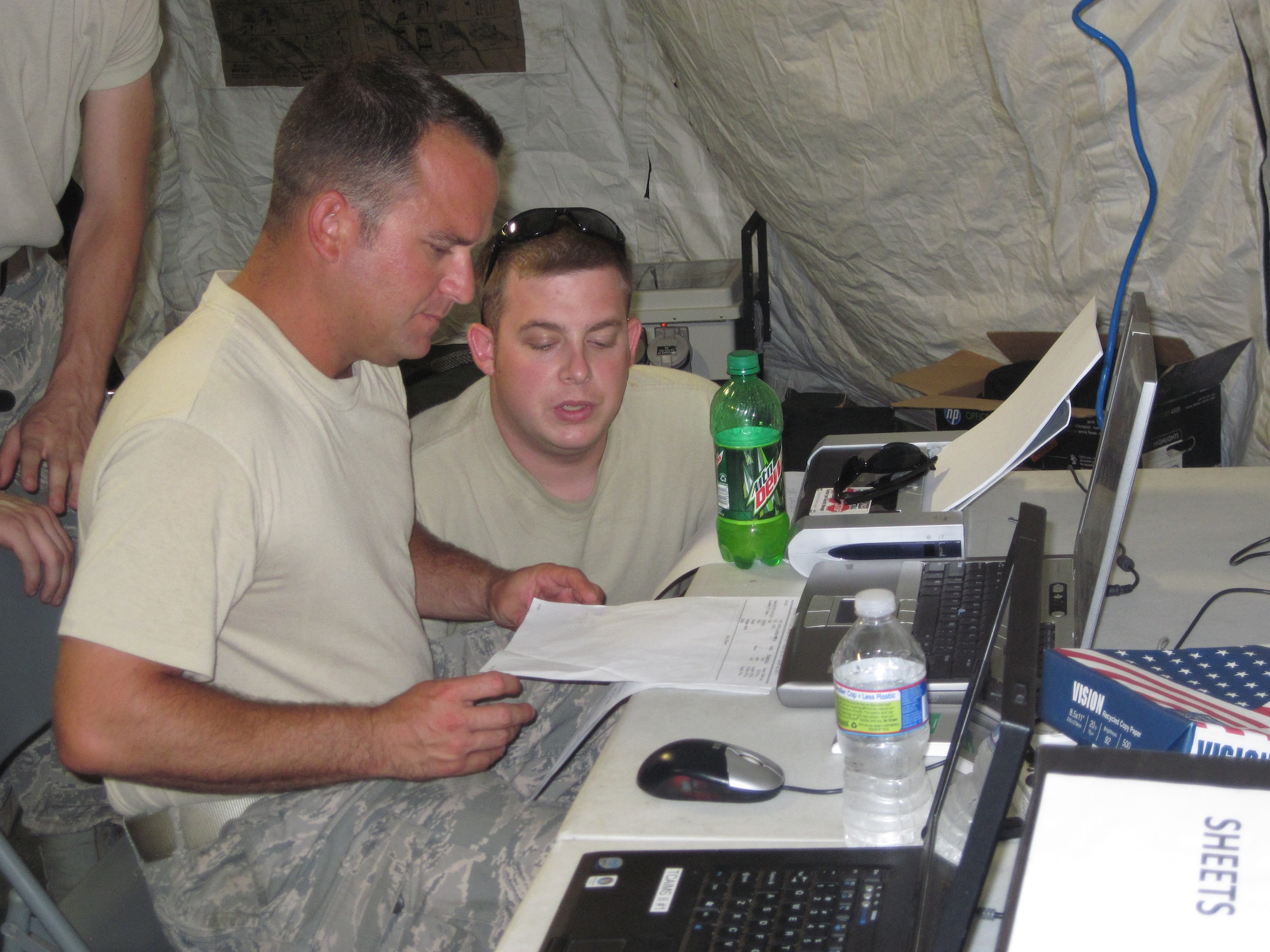 Staff Sgt. Steven Hildt  (left)left, and Staff Sgt. Travis Riley, 633rd Logistics Readiness Squadron Small Air Terminal Unit load planners, set up load plans for aircraft chalks Aug. 4. 2011. Hildt and Riley were part of a joint contingency-training exercise at Fort Eustis, Va.  (U.S. Air Force Photo by Senior Master Sgt.  Ron Golden/Released)