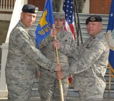 In a first ever 90th Security Forces Group triple change-of-command ceremony, Capt. Kenneth Bush assumes command of the 90th Missile Security Forces Squadron from the currently deployed Maj. Joel Briske here Aug. 26. (U.S. Air Force photo by Blaze Lipowski)