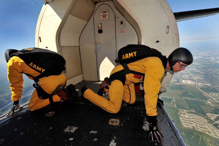 U.S. Army Sgt. Trevor Oppenborn, with the U.S. Army Golden Knights demonstration team, peers out the door of a Fokker C-31A Troopship in preparation for his jump during the 2011 Defenders of Freedom Open House and Air Show at Offutt Air Force Base, Neb., Aug. 27. The 30-minute show consists of several aircraft passes, or jump runs, with each pass consisting of one or more jumpers exiting and performing parachuting maneuvers. (U.S. Air Force photo by Charles Haymond/Released)