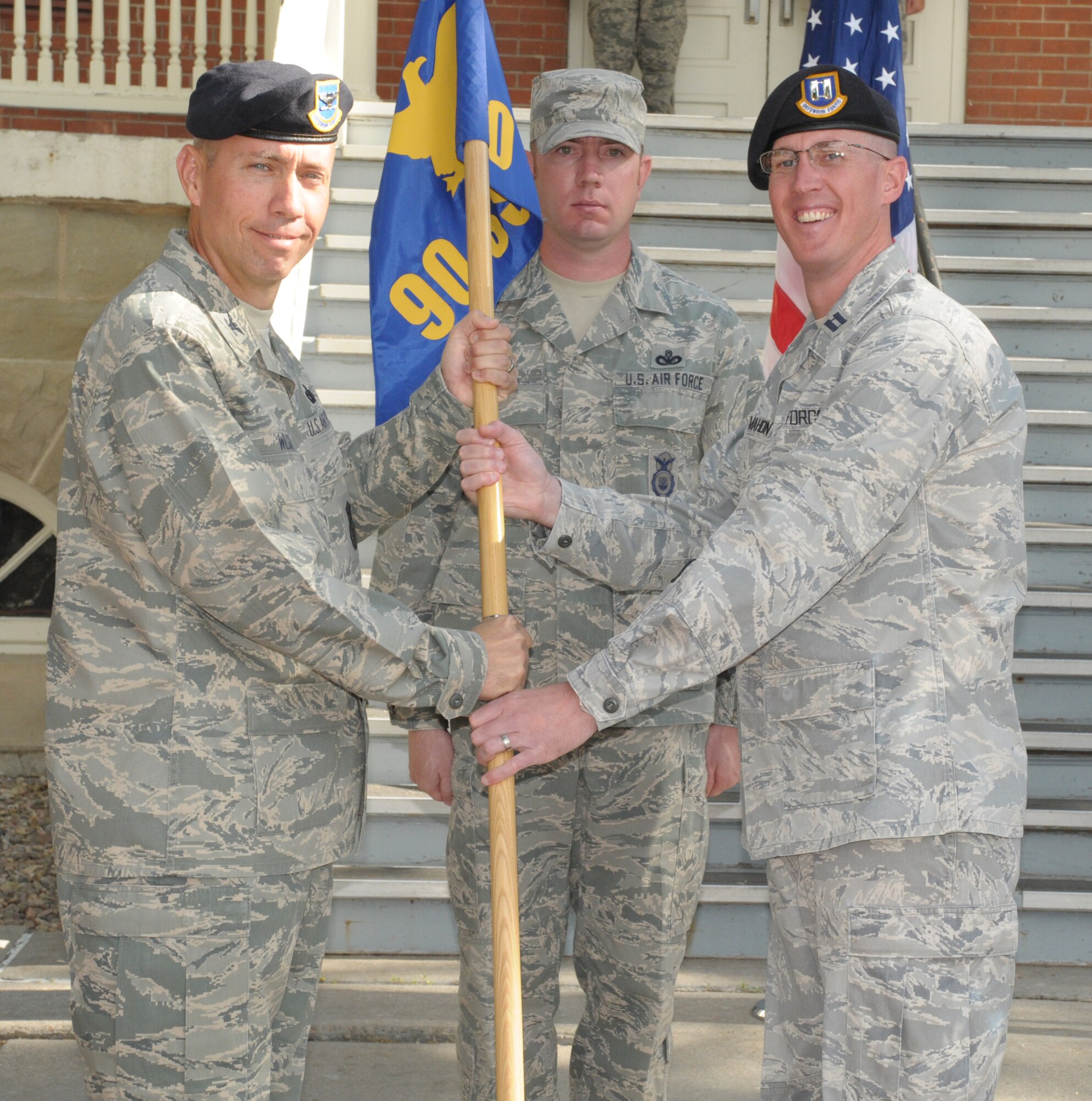 Prior to assuming command of the 790th Missile Security Forces Squadron, Capt. Kevin McMahon relinquishes command of the 90th Security Support Squadron during the 90th Security Forces Group triple change-of-command ceremony held here Aug. 26. (U.S. Air Force photo by Blaze Lipowski)
