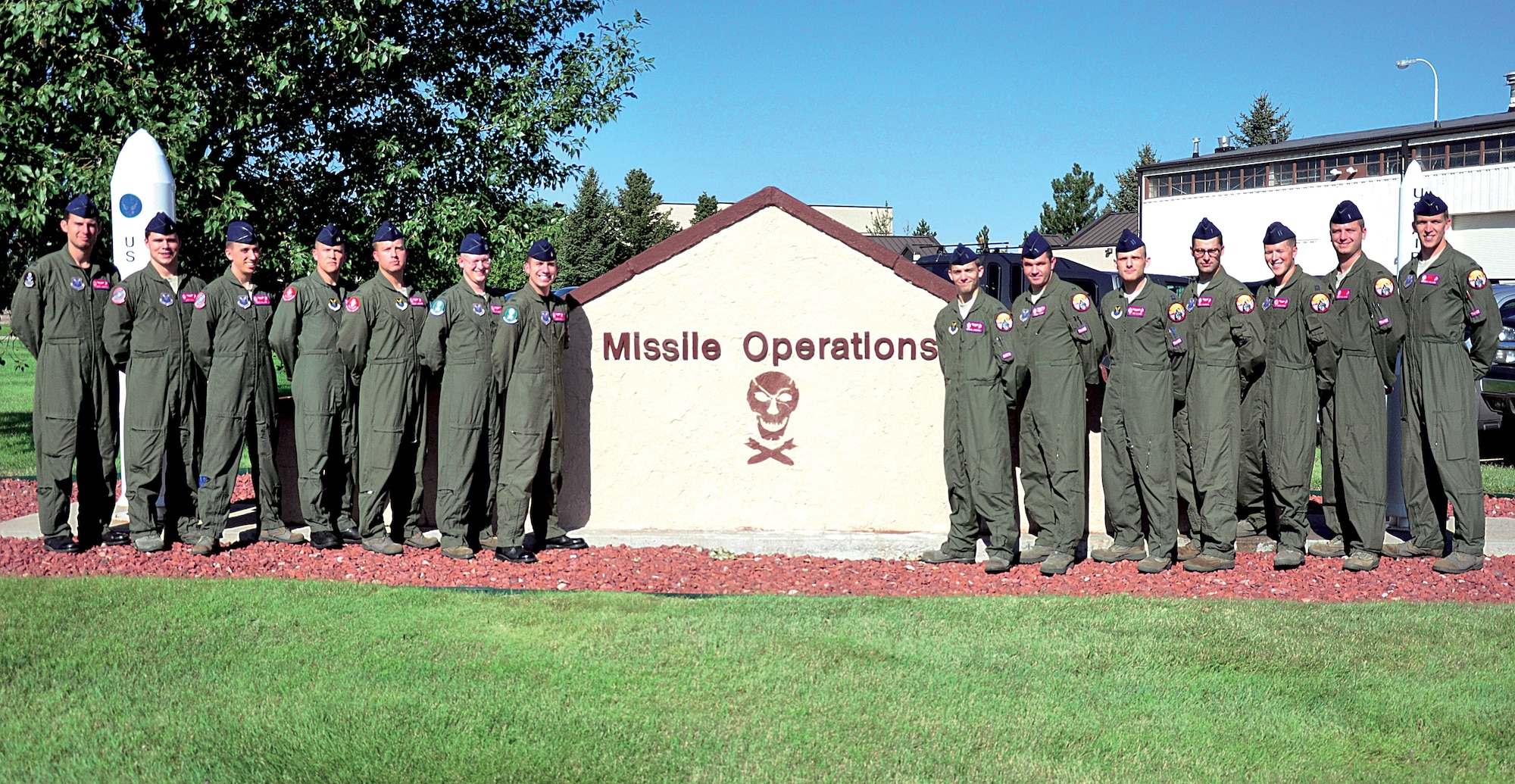 The 90th Operations Group ICBM competitors and trainers pose for a team photo in front of the Missile Procedures Trainer Aug. 25. This year’s Global Strike Challenge operations group members are Capt. Michael Sherman, 90th Operations Group assistant lead trainer; 1st Lt. Matt Dyal, 319th Missile Squadron trainer; 1st Lt. Ross Millard, 319th MS competitor; Capt. Paul Hendrickson, 320th Missile Squadron competitor; 1st Lt. James Henline, 320th MS trainer; Capt. Philip Freeman, 321st Missile Squadron competitor; 1st Lt. Joseph Zito, 321st MS trainer; 1st Lt. Michael Urbansky, 321st MS competitor; 1st Lt. Bobby Farmer, 319th MS trainer; Capt. Jonathan Elsner, 90th OG lead trainer; 1st Lt. Paul Comaroto, 320th MS competitor; Capt. Andrew Stevens, 319th MS competitor; 1st Lt. Timothy Hicks, 320th MS trainer; and 1st Lt. Graeme Williams, 321st MS trainer. (U.S. Air Force photo by Staff Sgt. Mike Tryon)