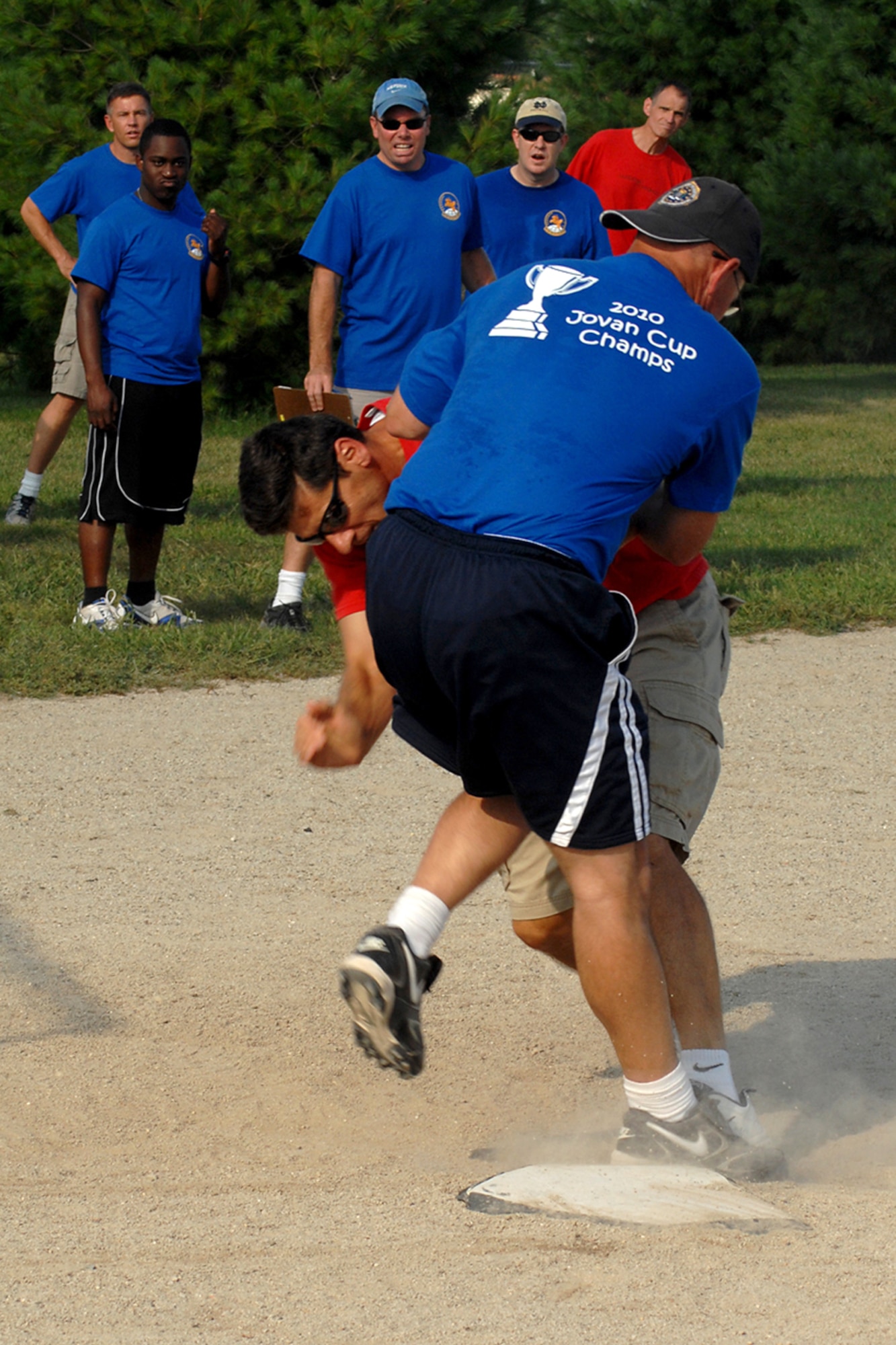 GRISSOM AIR RESERVE BASE, Ind.-- Scott Ward protects home base as Dave Schmidt heads his way the 5th Annual Jovanovich Cup Aug. 13th. Every year the Fightin' Red Tags and the Dark Side battle it out for the trophy and bragging rights. This year the Red Tags edged the Dark Siders, 13-12. The event is held in memory of Lt. Col. George Jovanovich who died in a car accident in March 2006. (U.S. Air Force photo/Senior Airman Jami K. Lancette)