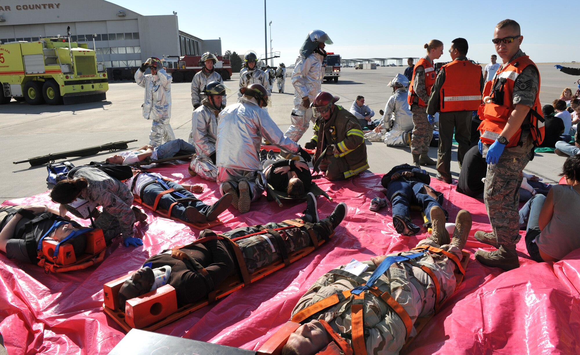 MOUNTAIN HOME AIR FORCE BASE, Idaho – Gunfighters participate in an accident exercise in order to prepare for possible future situations here, Sept. 1. The injured are placed on different colored tarps based on the seriousness of their injuries. (U.S. Air Force photo by Airman 1st Class Heather Hayward)