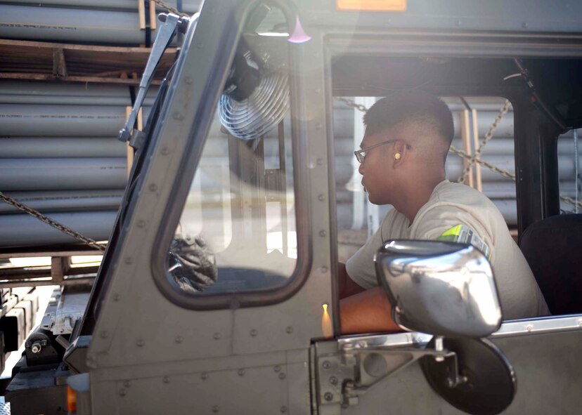 Air Force Staff Sgt. Jeffrey Cunanan hauls cargo Sept. 6, 2011 at Incirlik Air Base, Turkey. Cunanan is currently deployed here from the 86th Aerial Port Squadron, McChord Field, Wash., and volunteered to extend his tour at Incirlik six months. (U.S. Air Force photo by Senior Airman Clayton Lenhardt)