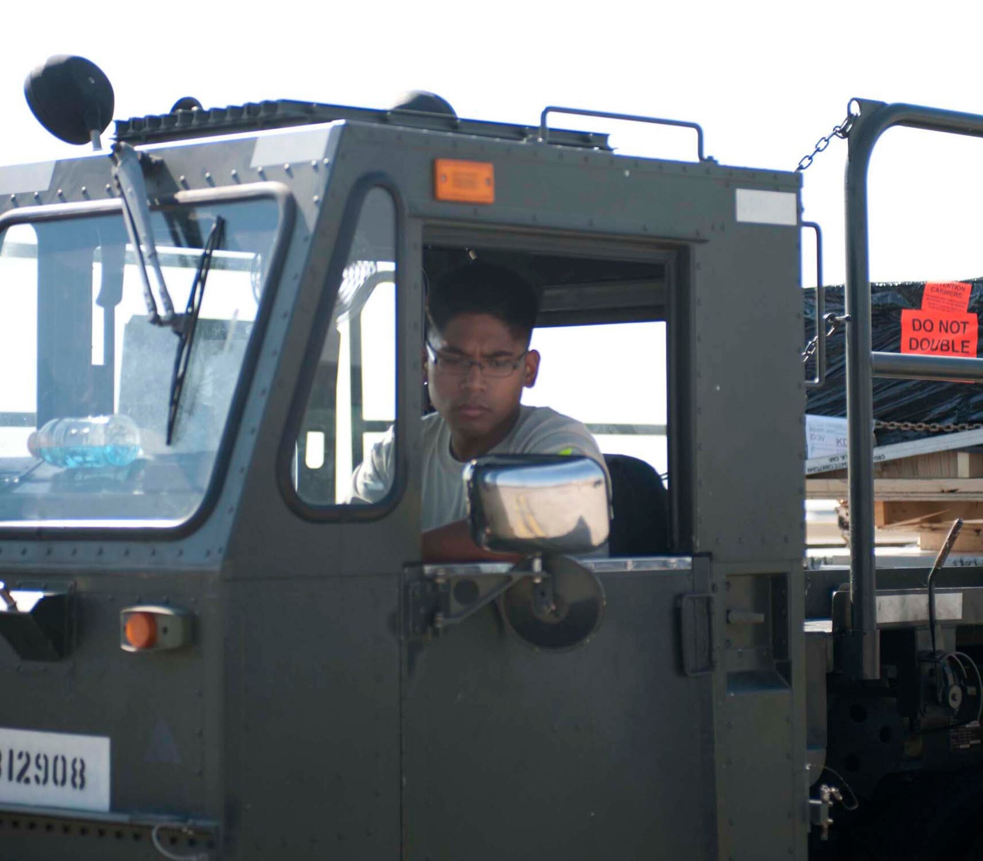 Air Force Staff Sgt. Jeffrey Cunanan hauls cargo Sept. 6, 2011 at Incirlik Air Base, Turkey. Cunanan is currently deployed here from the 86th Aerial Port Squadron, McChord Field, Wash., and volunteered to extend his tour at Incirlik six months. (U.S. Air Force photo by Senior Airman Clayton Lenhardt)