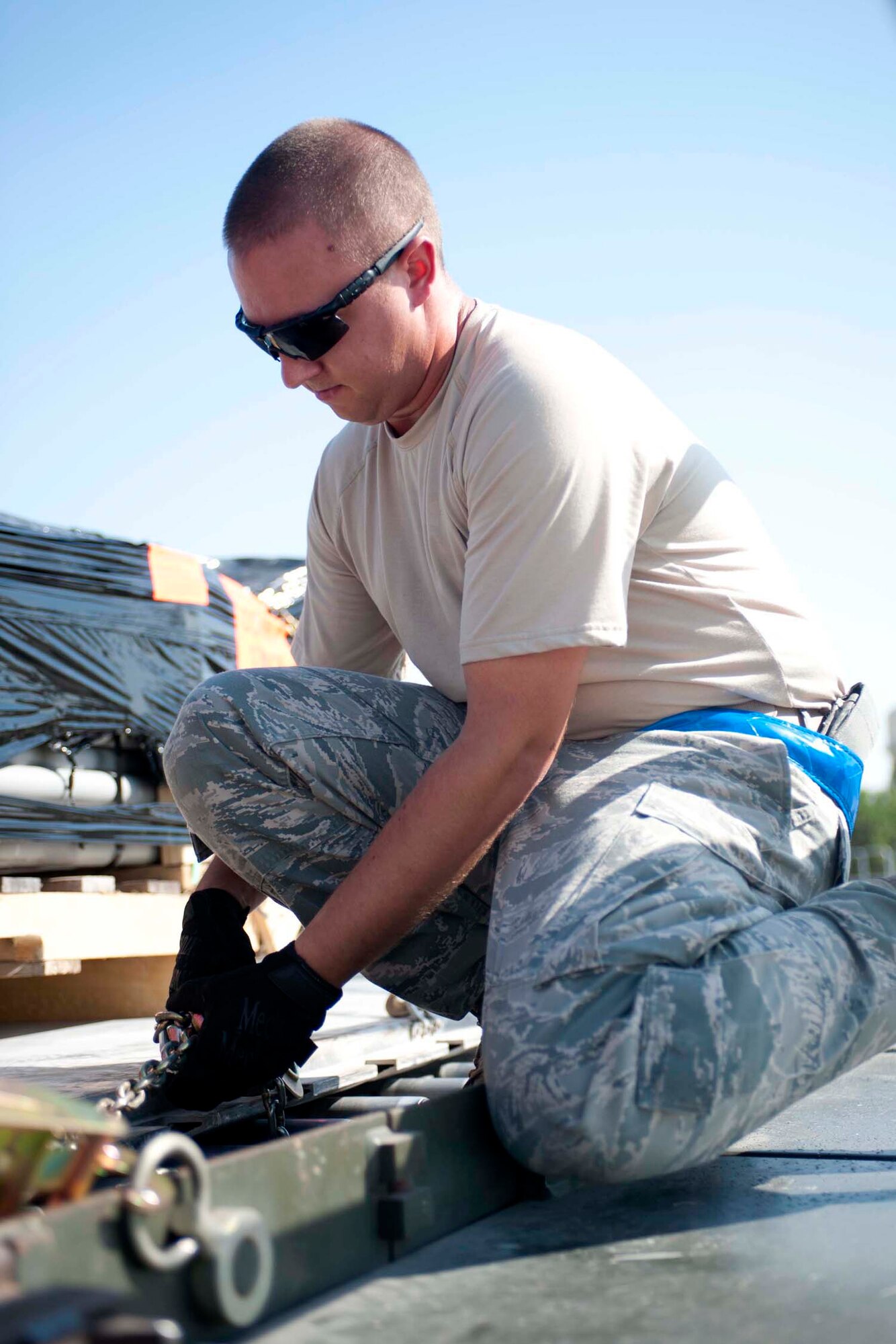 Air Force Senior Airman Daniel Henderson secures cargo Sept. 6, 2011 at Incirlik Air Base, Turkey. Henderson is currently deployed here from the 86th Aerial Port Squadron, McChord Field, Wash., and volunteered to extend his tour at Incirlik and additional six months. (U.S. Air Force photo by Senior Airman Clayton Lenhardt)