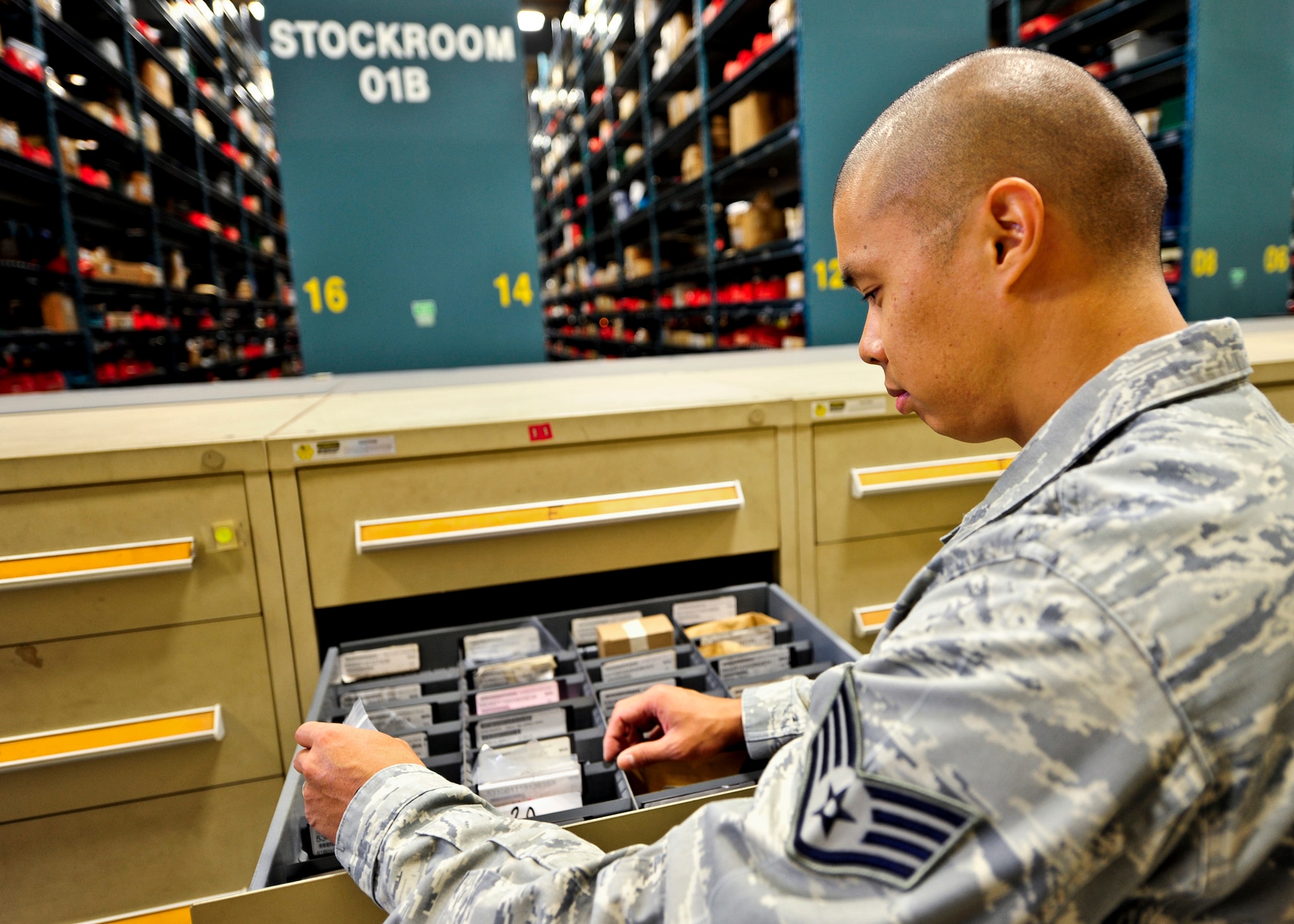 Staff Sgt. Jonathan Tomita, 96th Materiel Management Flight, searches the drawer for one of the thousands of small parts located in the storage cabinets within Eglin's supply warehouse.  Eglin's materiel management flight is the largest supply flight in the U.S.  Approximately 125 military and civilian personnel manage more than 50,000 items valued at $875 million.  They also manage more than 300 nonexpendable equipment accounts tracking more than $700 million in assets spread across Eglin and other locations. The materiel management flight is part of the 96th Logistics Readiness Squadron.  (U.S. Air Force photo/Samuel King Jr.)