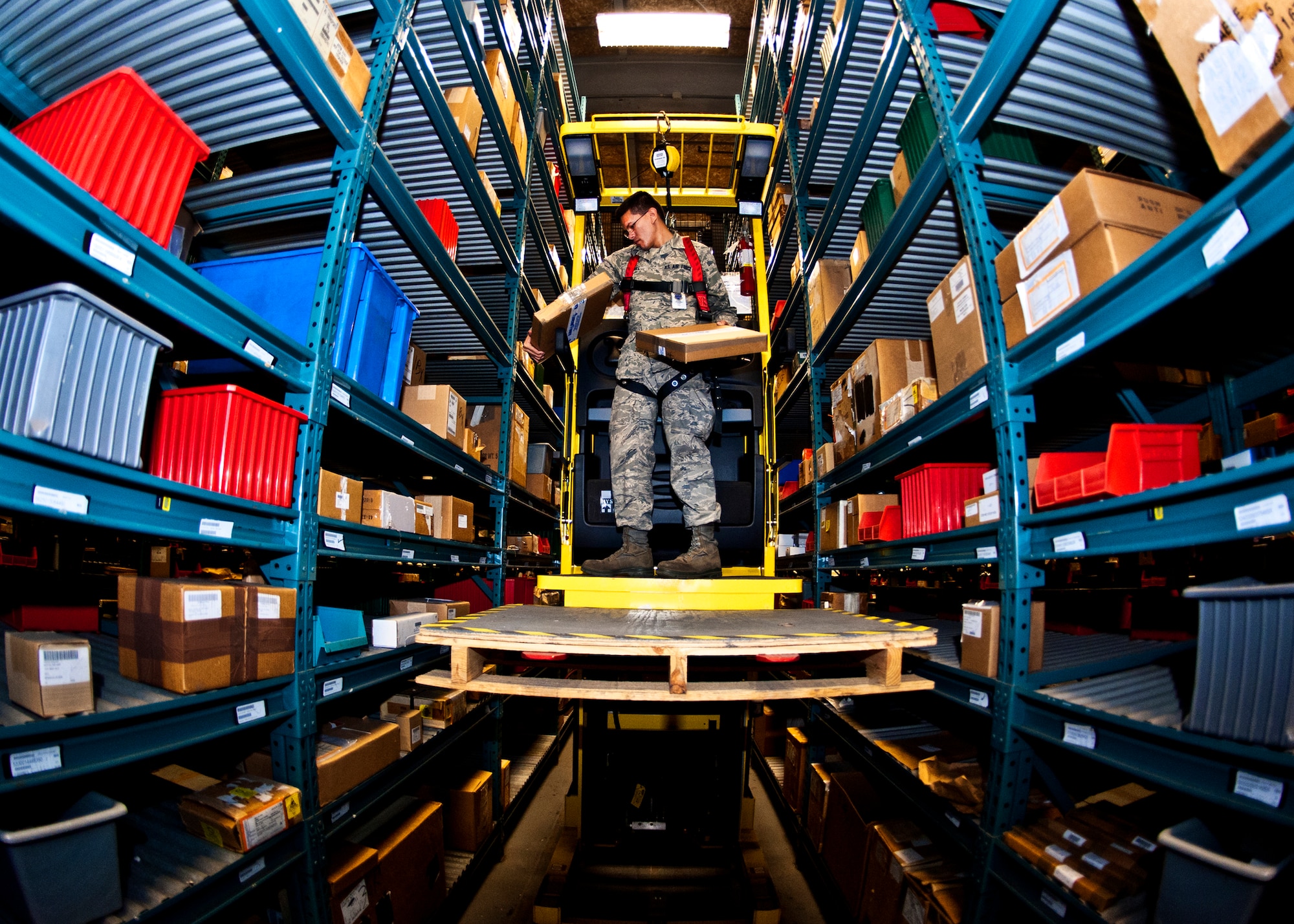 Airman 1st Class Andrew Hull, 96th Materiel Management Flight, gathers packages from the high shelves within Eglin's supply warehouse.  Eglin's materiel management flight is the largest supply flight in the U.S.  Approximately 125 military and civilian personnel manage more than 50,000 items valued at $875 million.  They also manage more than 300 nonexpendable equipment accounts tracking more than $700 million in assets spread across Eglin and other locations. The materiel management flight is part of the 96th Logistics Readiness Squadron.  (U.S. Air Force photo/Samuel King Jr.)