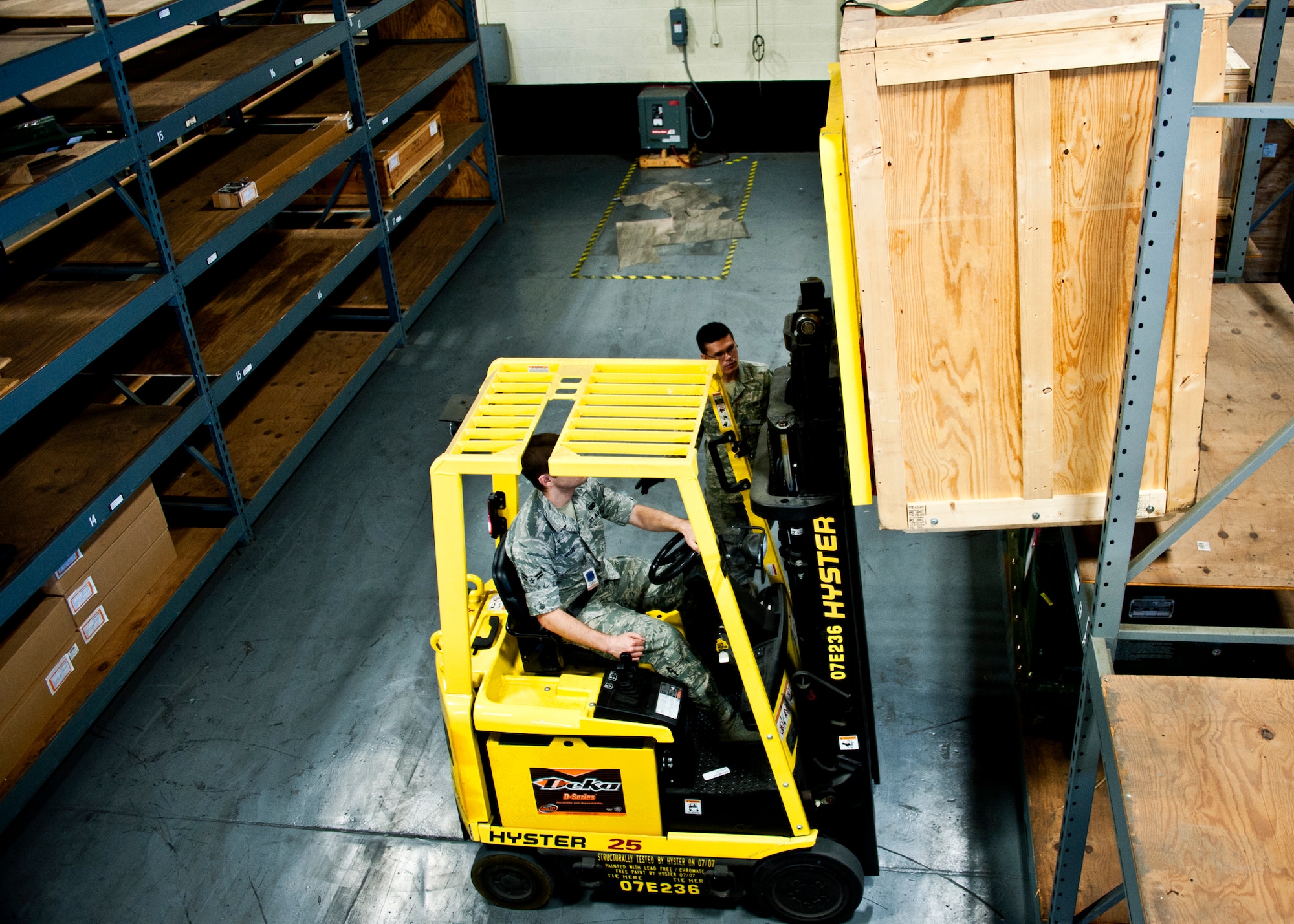 Airman 1st Class Jonathan McGee, 96th Materiel Management Flight, lifts a crate from one of the shelves in Eglin's supply warehouse.  Eglin's materiel management flight is the largest supply flight in the U.S.  Approximately 125 military and civilian personnel manage more than 50,000 items valued at $875 million.  They also manage more than 300 nonexpendable equipment accounts tracking more than $700 million in assets spread across Eglin and other locations. The materiel management flight is part of the 96th Logistics Readiness Squadron.  (U.S. Air Force photo/Samuel King Jr.)