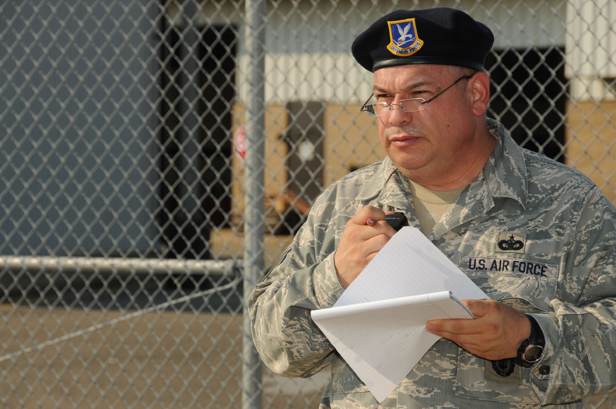 Tech. Sgt. Eithel Selvacastillo, 81st Security Forces Squadron, works to prepare a cordon around enter Matero Hall during a bioterrorism exercise Aug. 31.  In the scenario, a package was delivered containing a suspicious white power substance was delivered.  Two "victims" required medical treatment and 60 occupants of the building  were evacuated and underwent decontamination as a precaution.  (U.S. Air Force photo by Kemberly Groue)