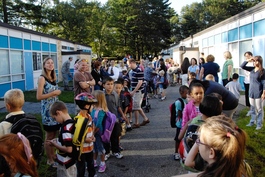 HANSCOM AIR FORCE BASE, Mass. – Students, parents and teachers line up outside the primary and middle schools on the first day of school, Aug. 31. For information about primary, middle and high school events, check the School Notes section of the newspaper or website. (U.S. Air Force photo by Linda LaBonte Britt)