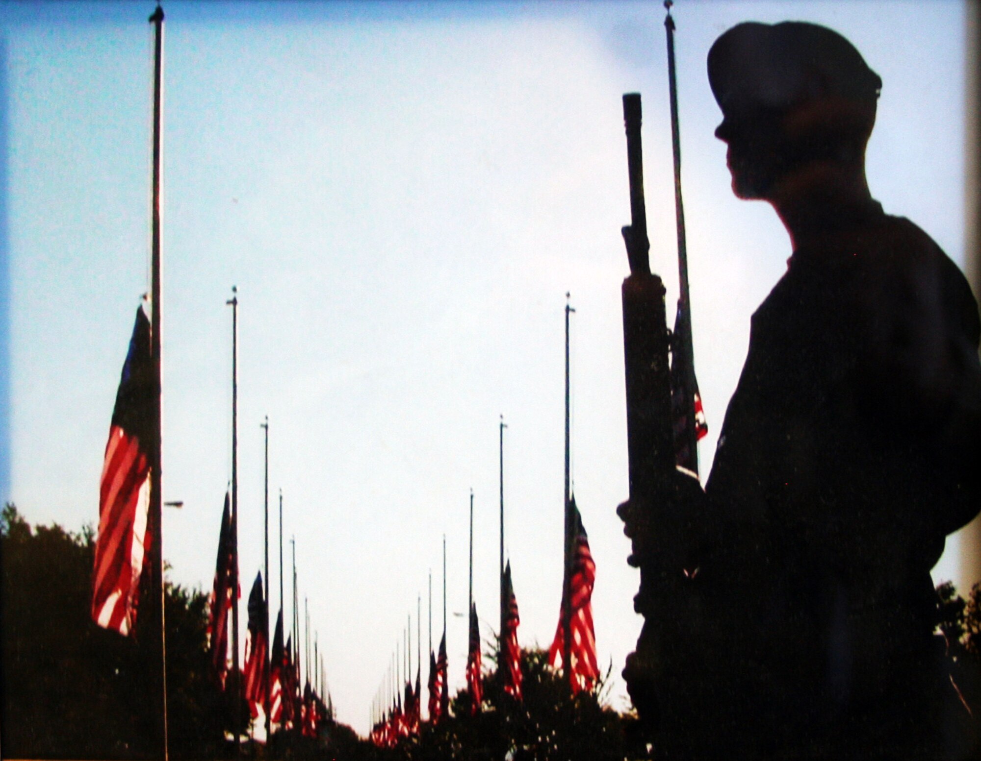 A security forces Airman from the 319th Security Forces Squadron watches over the main gate area of Grand Forks Air Force Base, N.D., on Sept. 11, 2002 -- the first anniversary of the Sept. 11, 2001, attacks. (U.S. Air Force Photo/Master Sgt. Scott T. Sturkol)