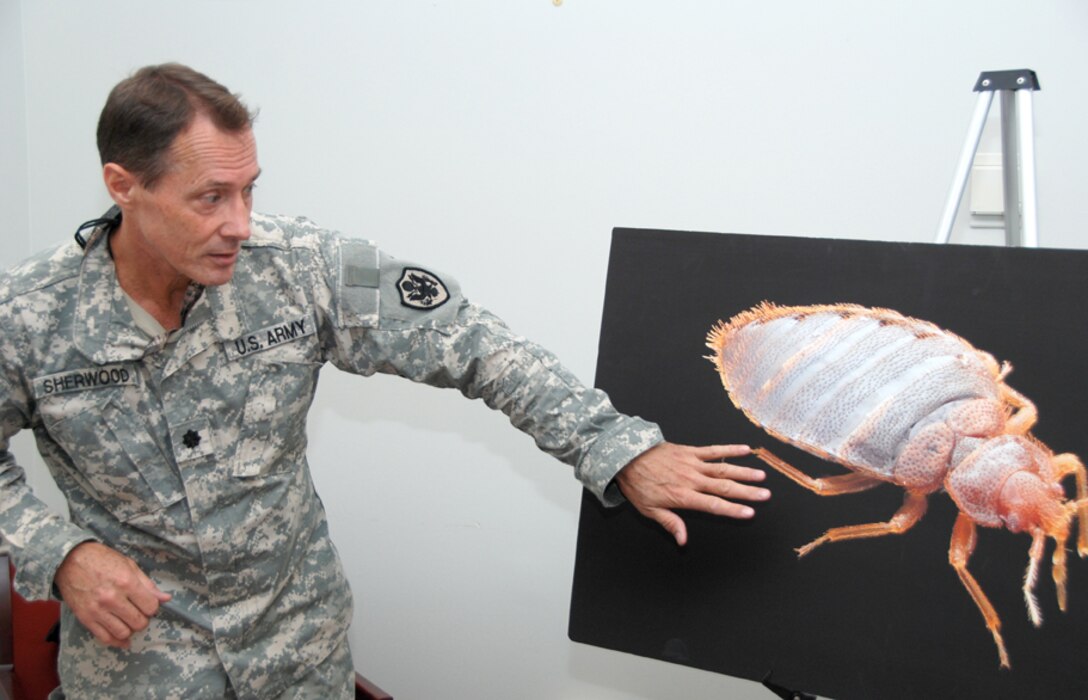 Army Lt. Col. Van Sherwood gives a presentation on bed bugs during an Earth Day observance at the McNamara Headquarters Complex, on Fort Belvoir, Va. DLA Photo by Jonathan Stack