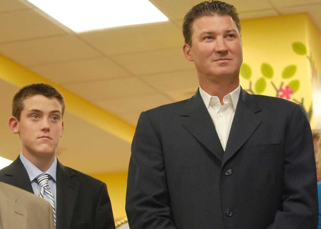 Hockey legend Mario Lemieux and his son, Austin, attend the dedication ceremony for the Austin’s Warrior Playroom at Walter Reed National Military Medical Center in Bethesda, Md., Sept. 7, 2011. Lemieux’s foundation created the playroom, named after his son, to offer a place for children to learn and play while their parents attend medical appointments.DOD photo by Elaine Sanchez

