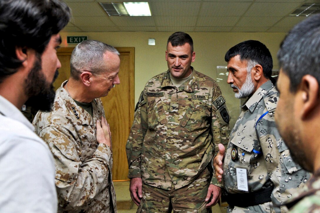 U.S. Marine Corps Gen. John R. Allen, commander of U.S. and international forces in Afghanistan, talks with troops assigned to Regional Command East in Nangarhar province, Afghanistan, Sept. 5, 2011. Allen received a briefing and walking tour of the Torkham Gate area of operations during his visit and thanked U.S. and Afghan forces for their service.