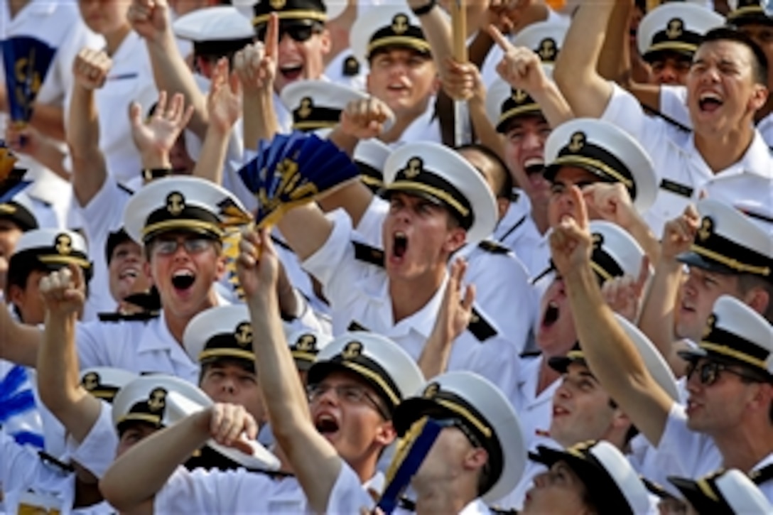 The brigade of U.S. Naval Academy midshipmen cheer a touchdown during the school's season-opening football game at Navy Marine Corps Stadium in Annapolis, Md., Sept. 3, 2011. Navy defeated the University of Delaware Blue Hens, 40-17.