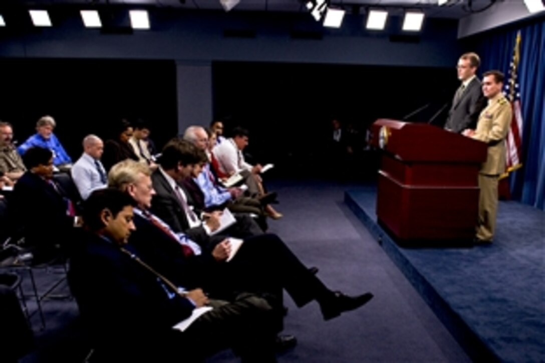 Pentagon Press Secretary George Little and Navy Capt. John Kirby, Joint Staff spokesman, answer questions during a press briefing at the Pentagon, Sept. 8, 2011.