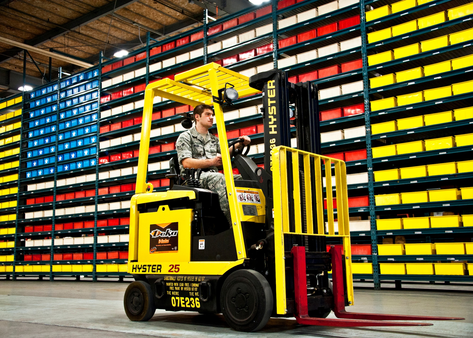Airman 1st Class Jonathan McGee, 96th Materiel Management Flight, drives a forklift through Eglin's supply warehouse.  Eglin's materiel management flight is the largest supply flight in the U.S.  Approximately 125 military and civilian personnel manage more than 50,000 items valued at $875 million.  They also manage more than 300 nonexpendable equipment accounts tracking more than $700 million in assets spread across Eglin and other locations. The materiel management flight is part of the 96th Logistics Readiness Squadron.  (U.S. Air Force photo/Samuel King Jr.)